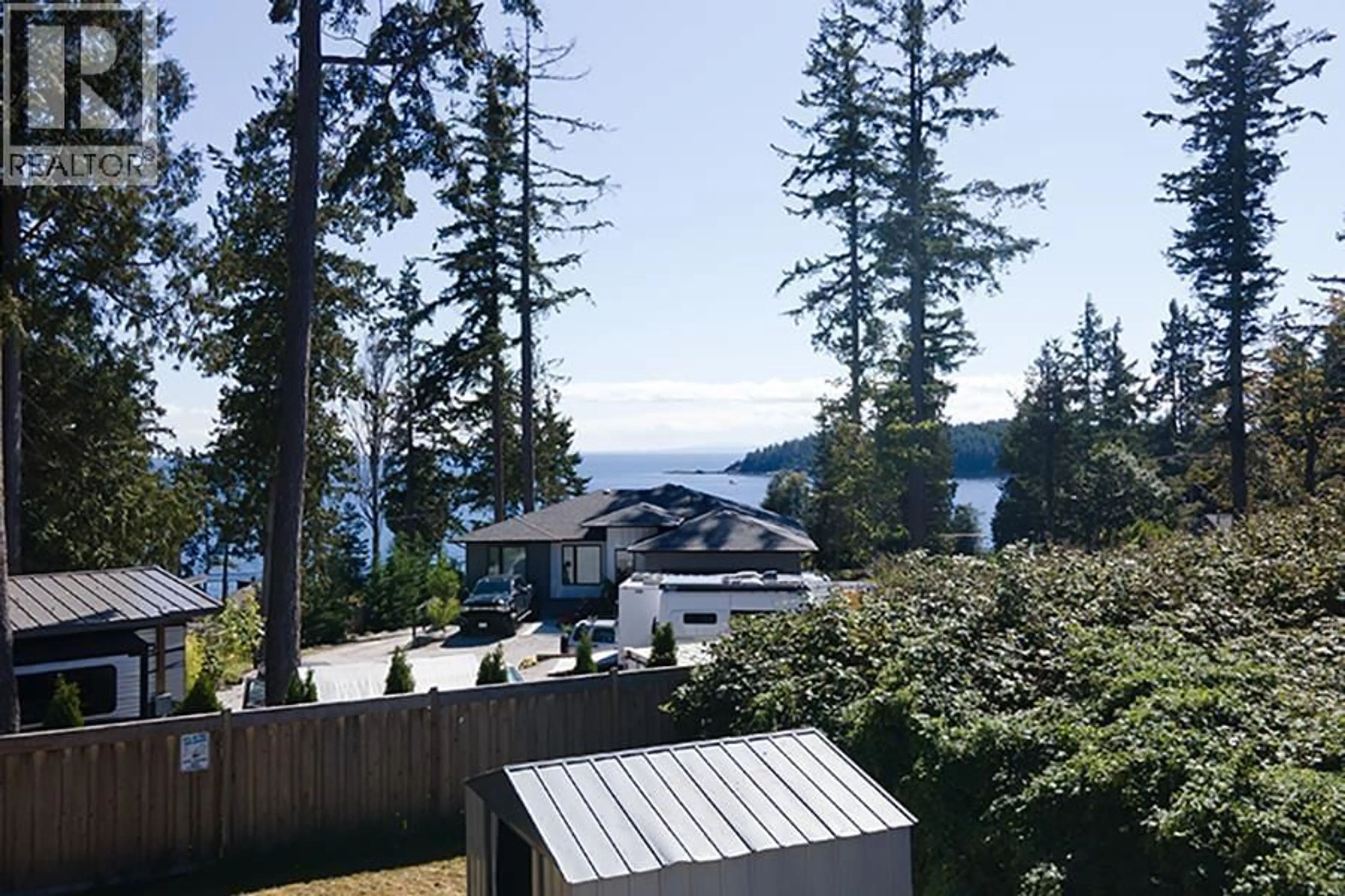 A pic from outside/outdoor area/front of a property/back of a property/a pic from drone, water/lake/river/ocean view for 6173 BLIGH ROAD, Sechelt British Columbia V7Z0M1