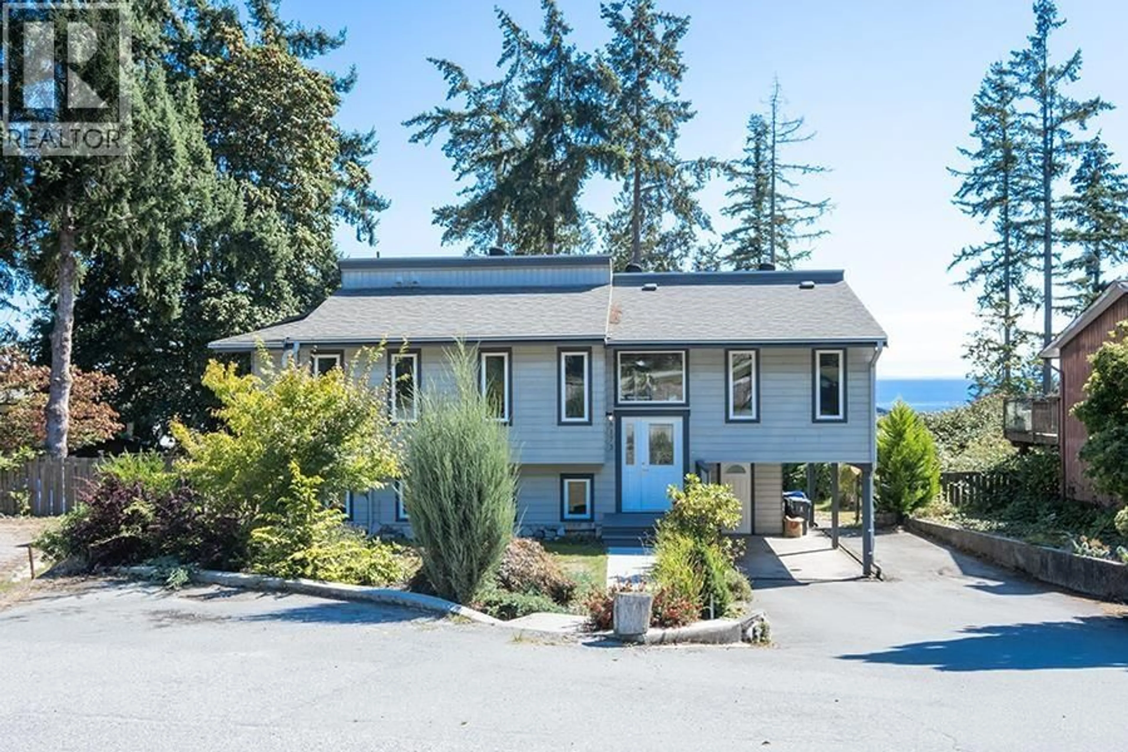 A pic from outside/outdoor area/front of a property/back of a property/a pic from drone, water/lake/river/ocean view for 6173 BLIGH ROAD, Sechelt British Columbia V7Z0M1