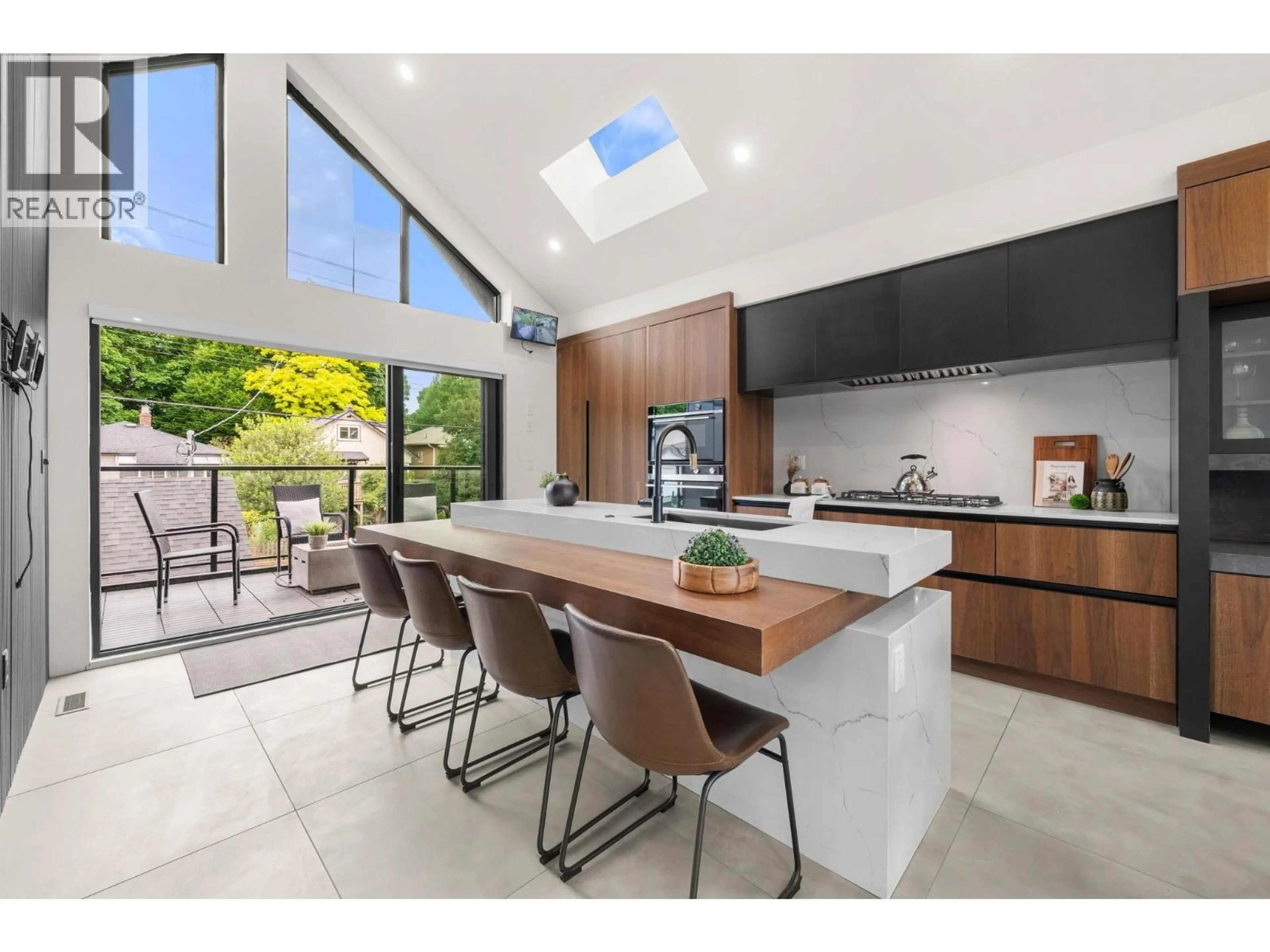 Contemporary kitchen, ceramic/tile floor for 5027 INVERNESS STREET, Vancouver British Columbia V5W3N7