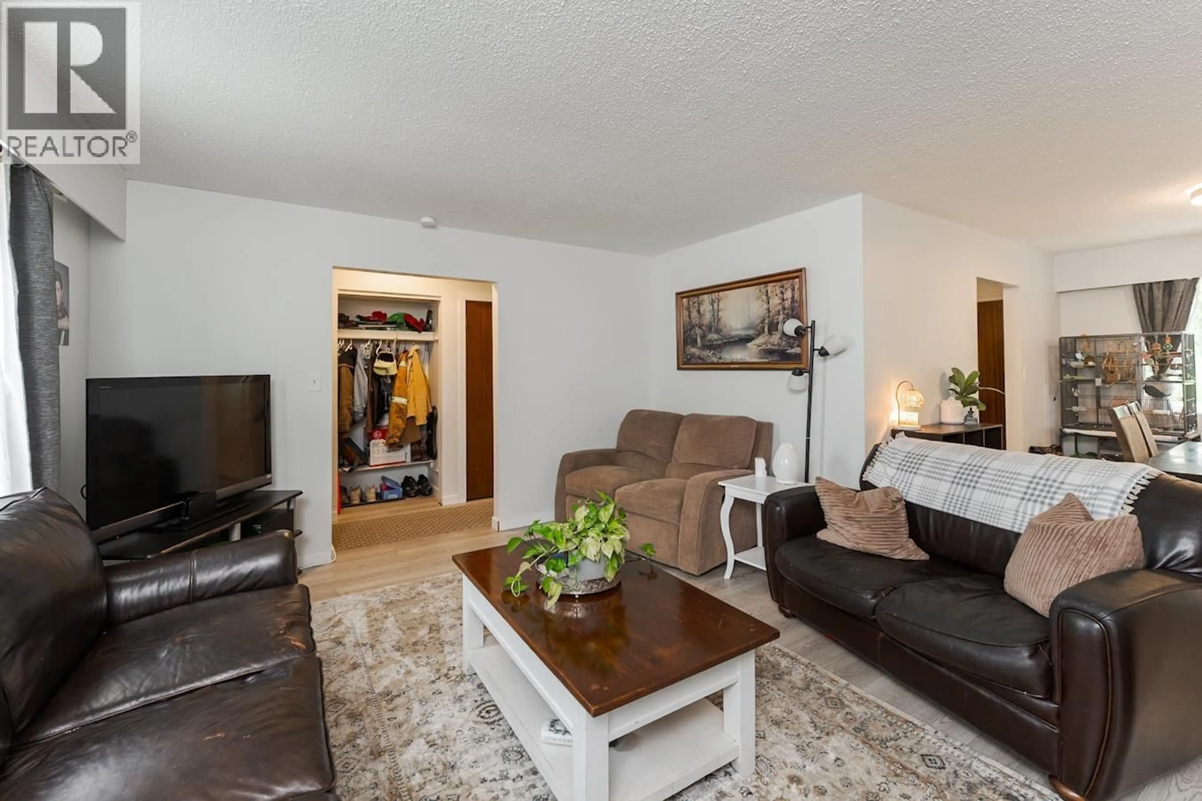 Living room with furniture, wood/laminate floor for 138 MCLEAN DRIVE, Prince George British Columbia V2M4R3
