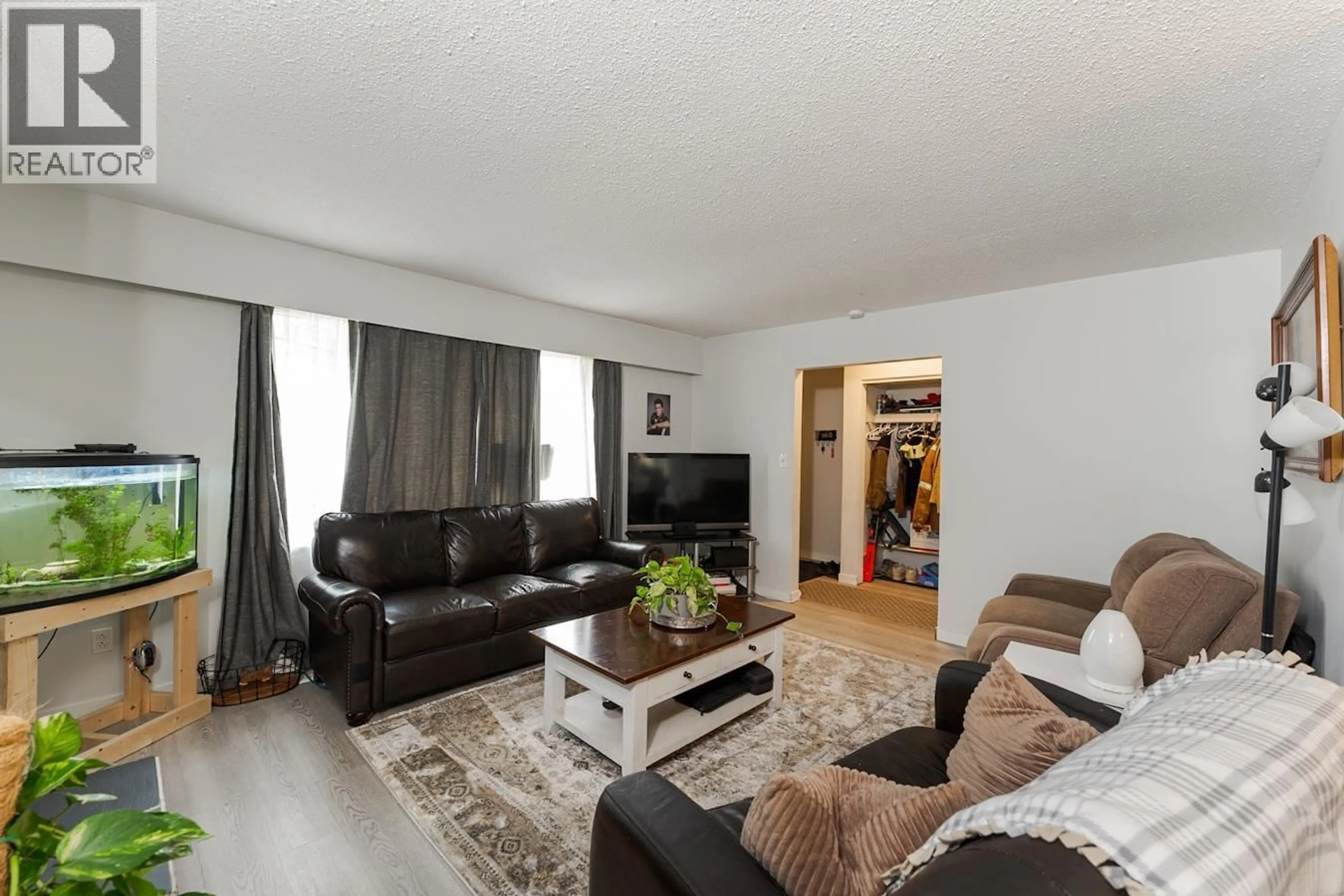 Living room with furniture, wood/laminate floor for 138 MCLEAN DRIVE, Prince George British Columbia V2M4R3