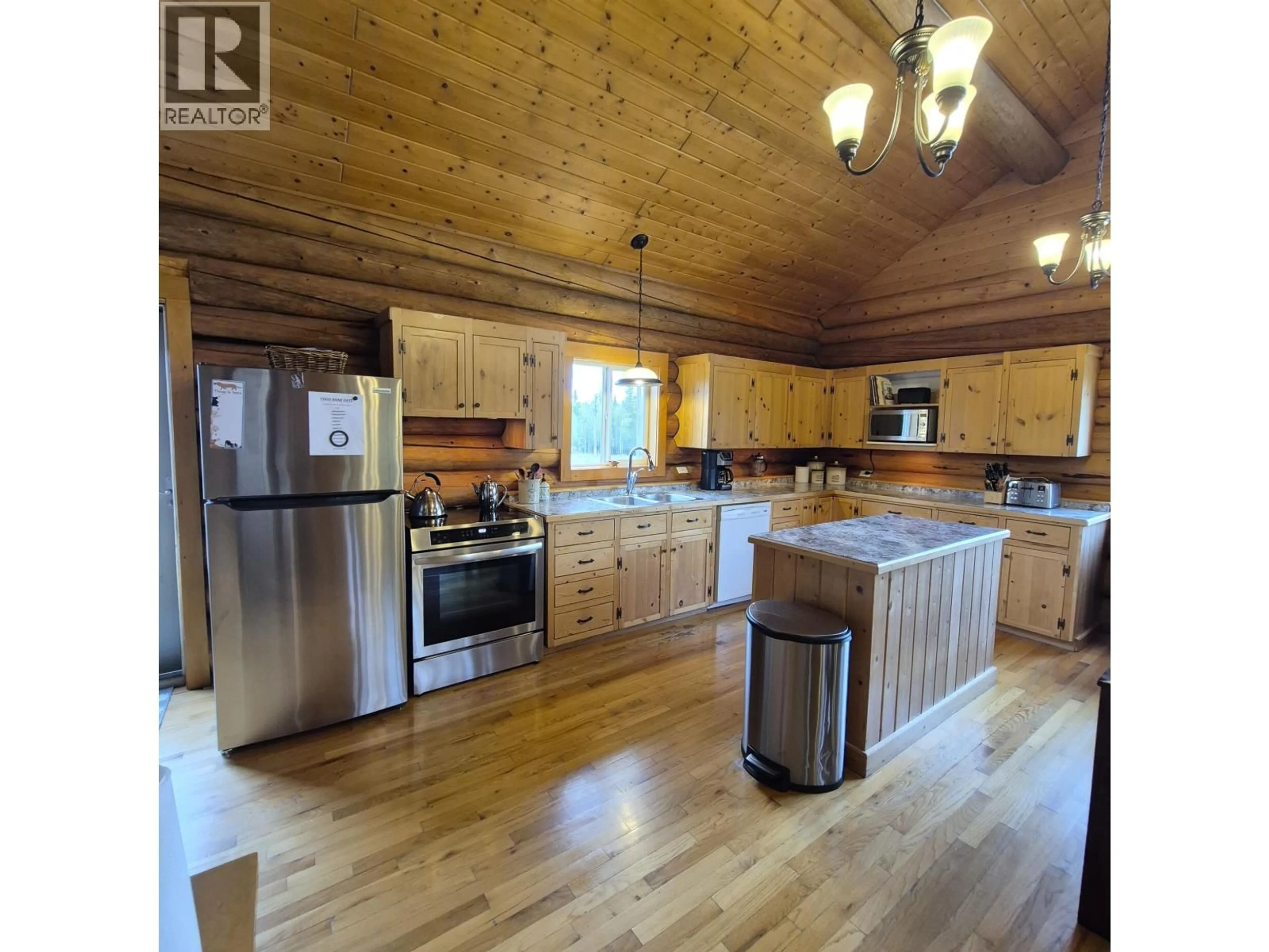 Open concept kitchen, wood/laminate floor for 17849 LANGSTON ROAD, Vanderhoof British Columbia V0J3A1