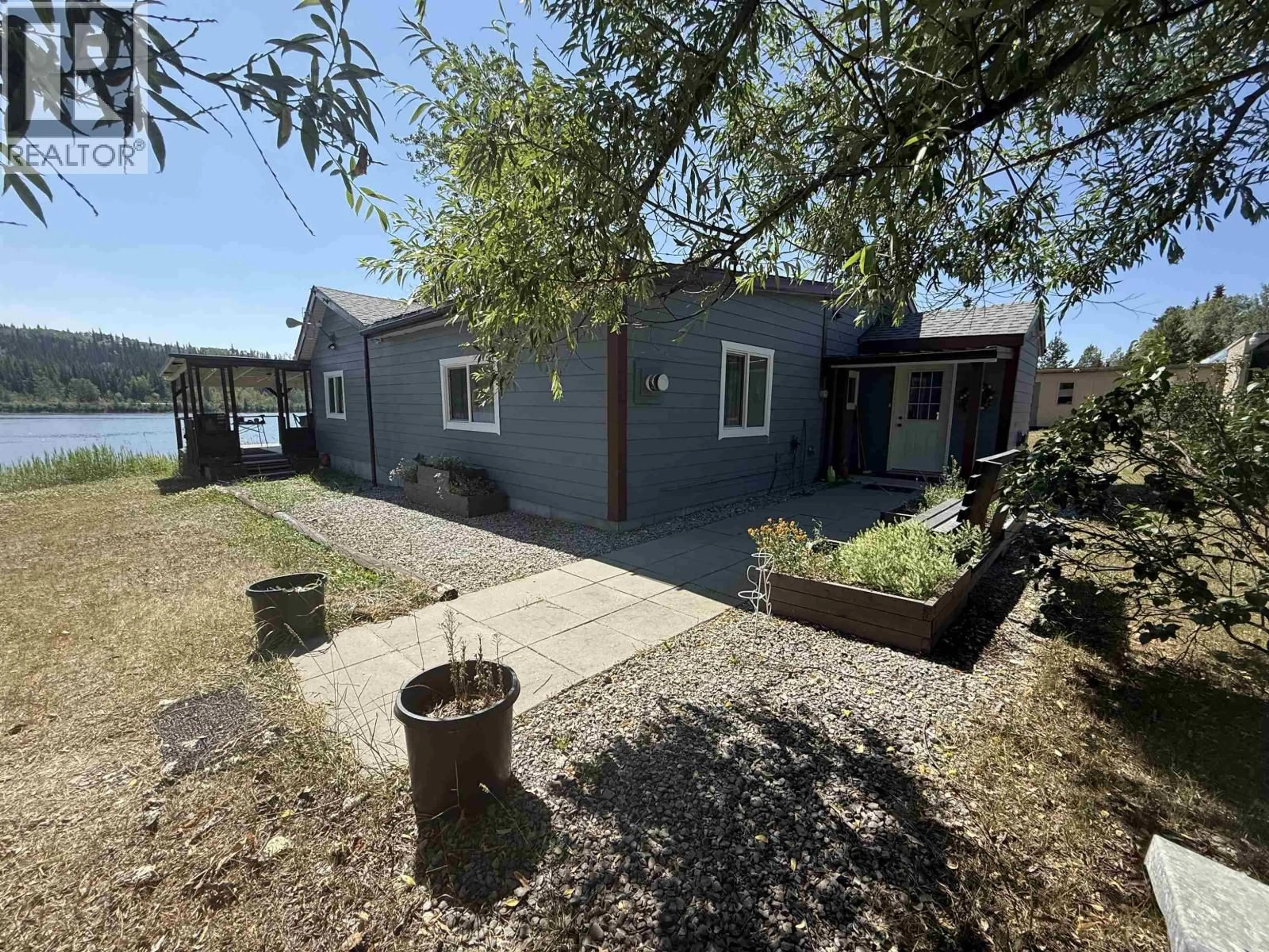 A pic from outside/outdoor area/front of a property/back of a property/a pic from drone, water/lake/river/ocean view for 27251 16 HIGHWAY, Burns Lake British Columbia V0J1E1
