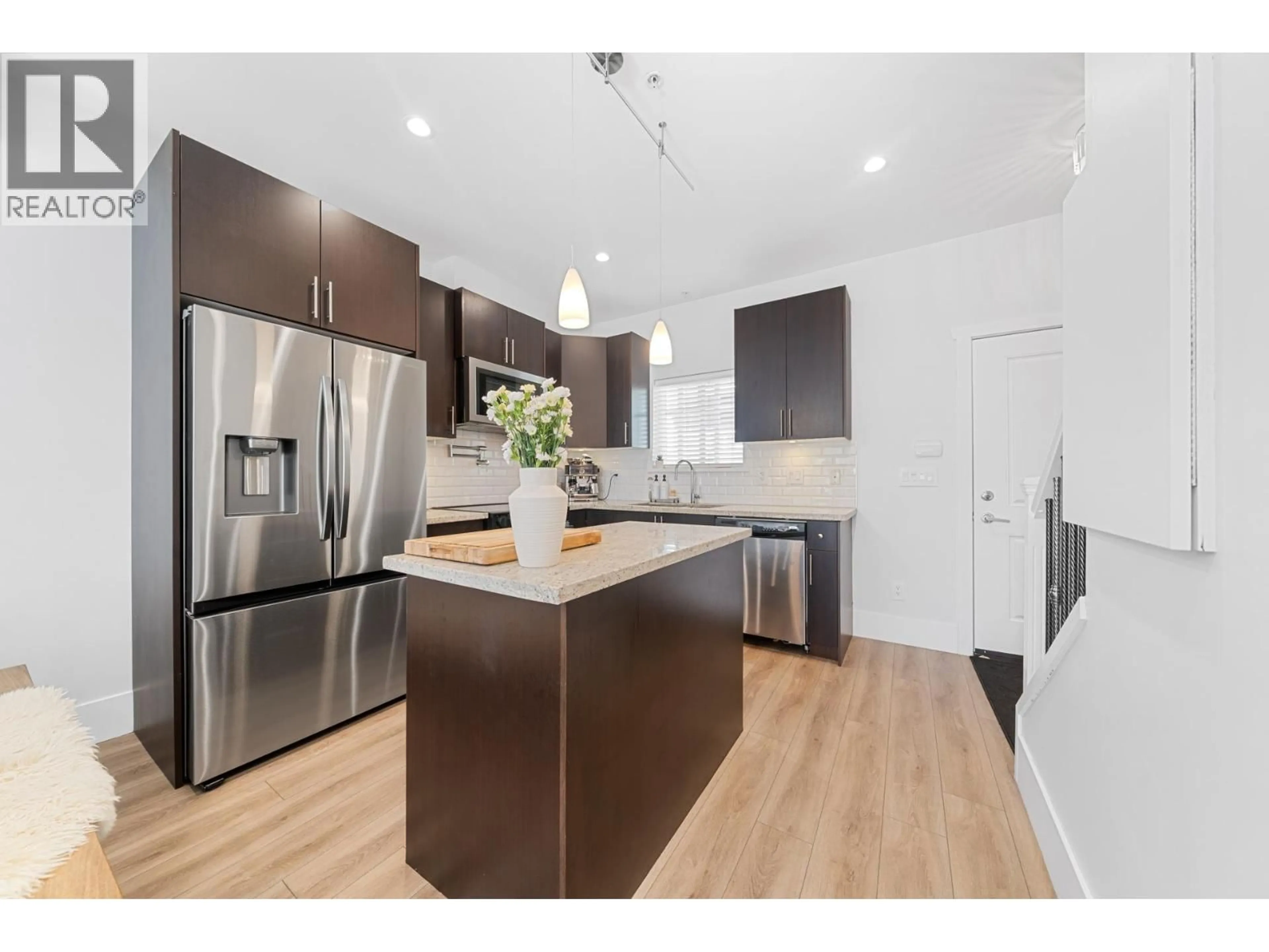 Open concept kitchen, wood/laminate floor for 223 - 368 ELLESMERE AVENUE, Burnaby British Columbia V5B3S9
