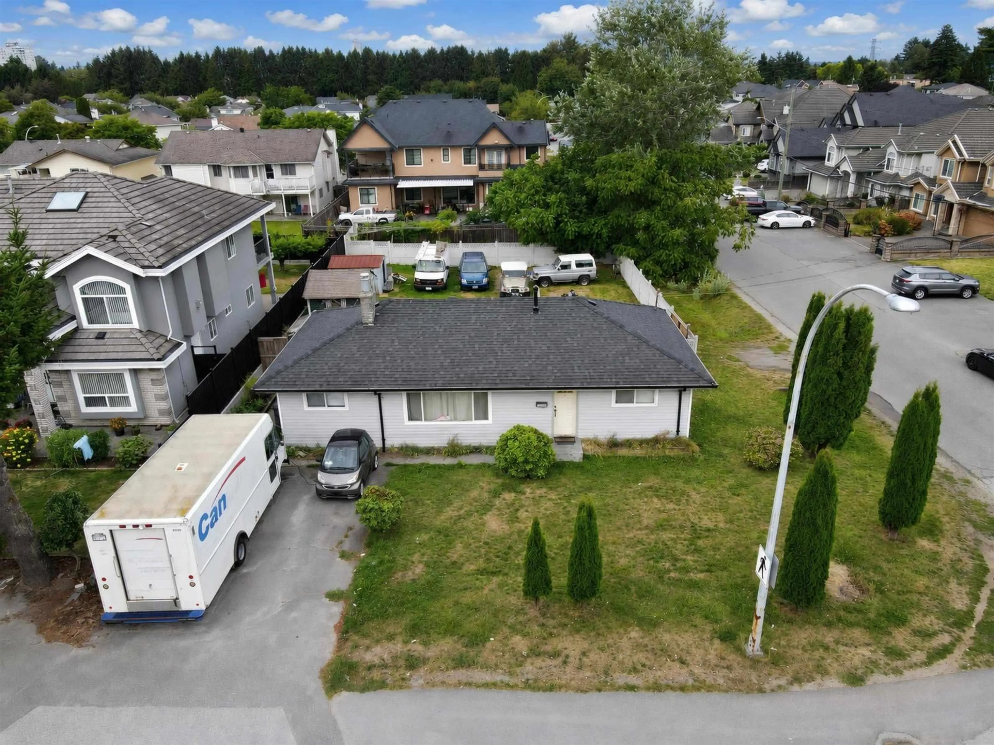A pic from outside/outdoor area/front of a property/back of a property/a pic from drone, street for 12141 84 AVENUE, Surrey British Columbia V3W6K6
