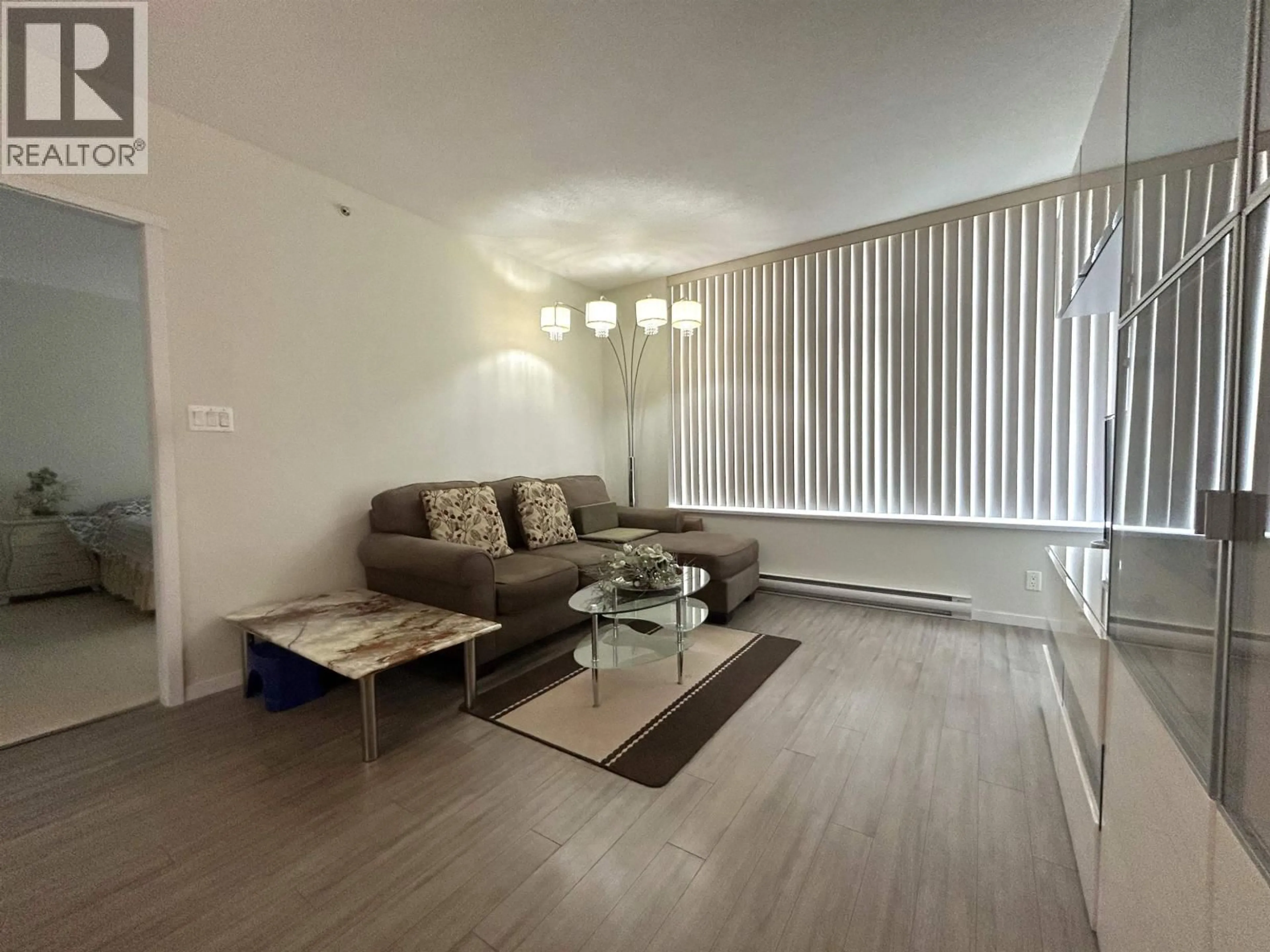 Living room with furniture, wood/laminate floor for 307 - 3102 WINDSOR GATE, Coquitlam British Columbia V3B0J3