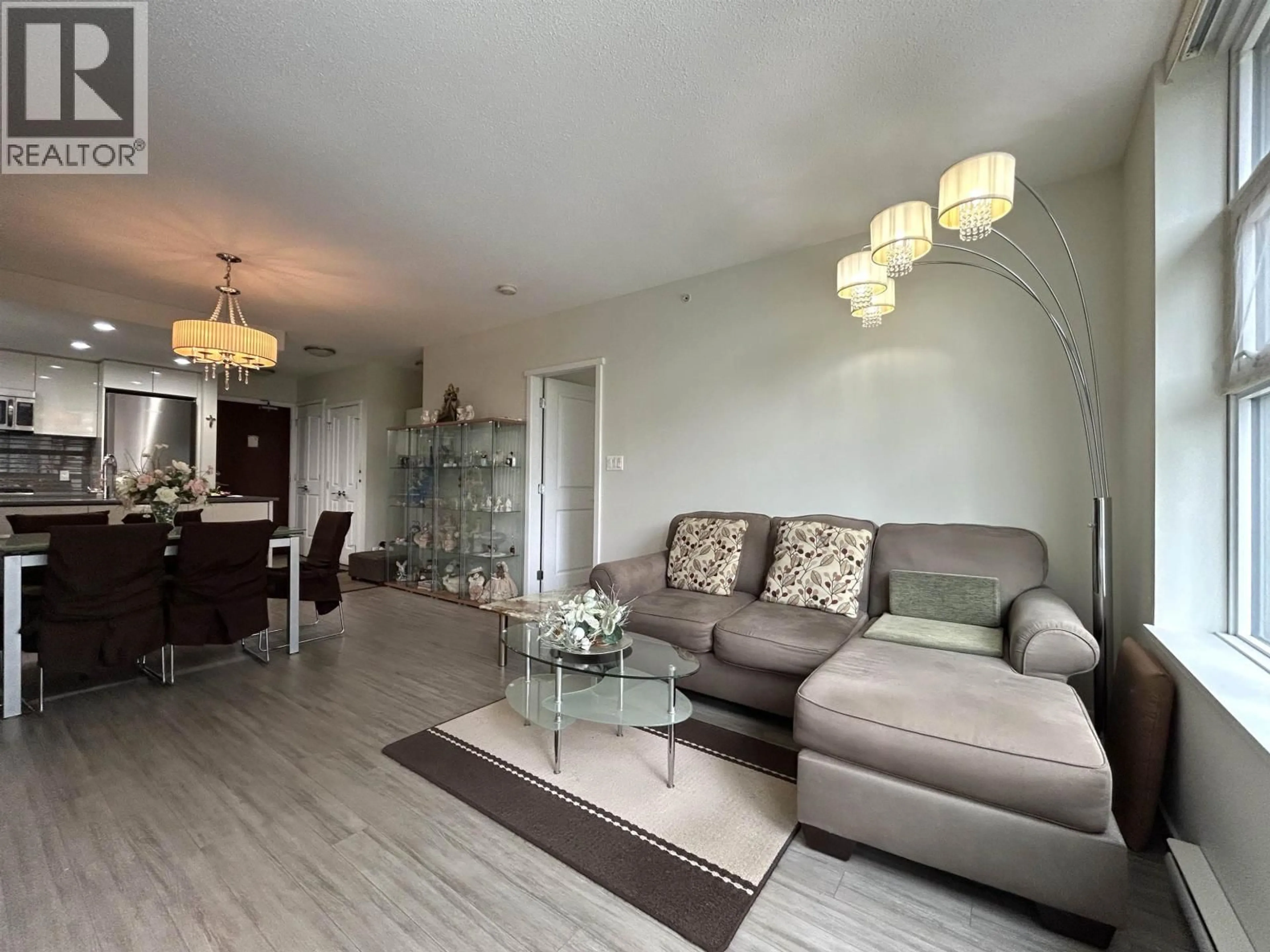 Living room with furniture, wood/laminate floor for 307 - 3102 WINDSOR GATE, Coquitlam British Columbia V3B0J3