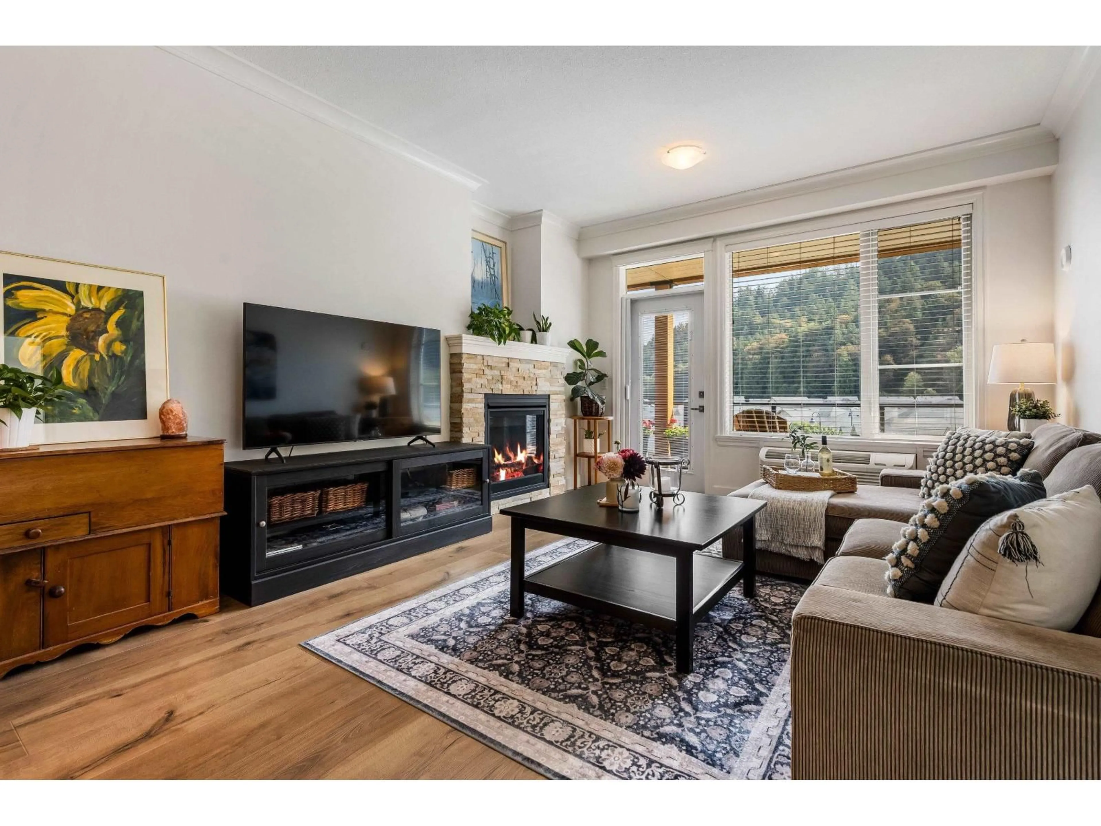 Living room with furniture, wood/laminate floor for 311 - 45746 KEITH WILSON ROAD, Chilliwack British Columbia V2R1J9
