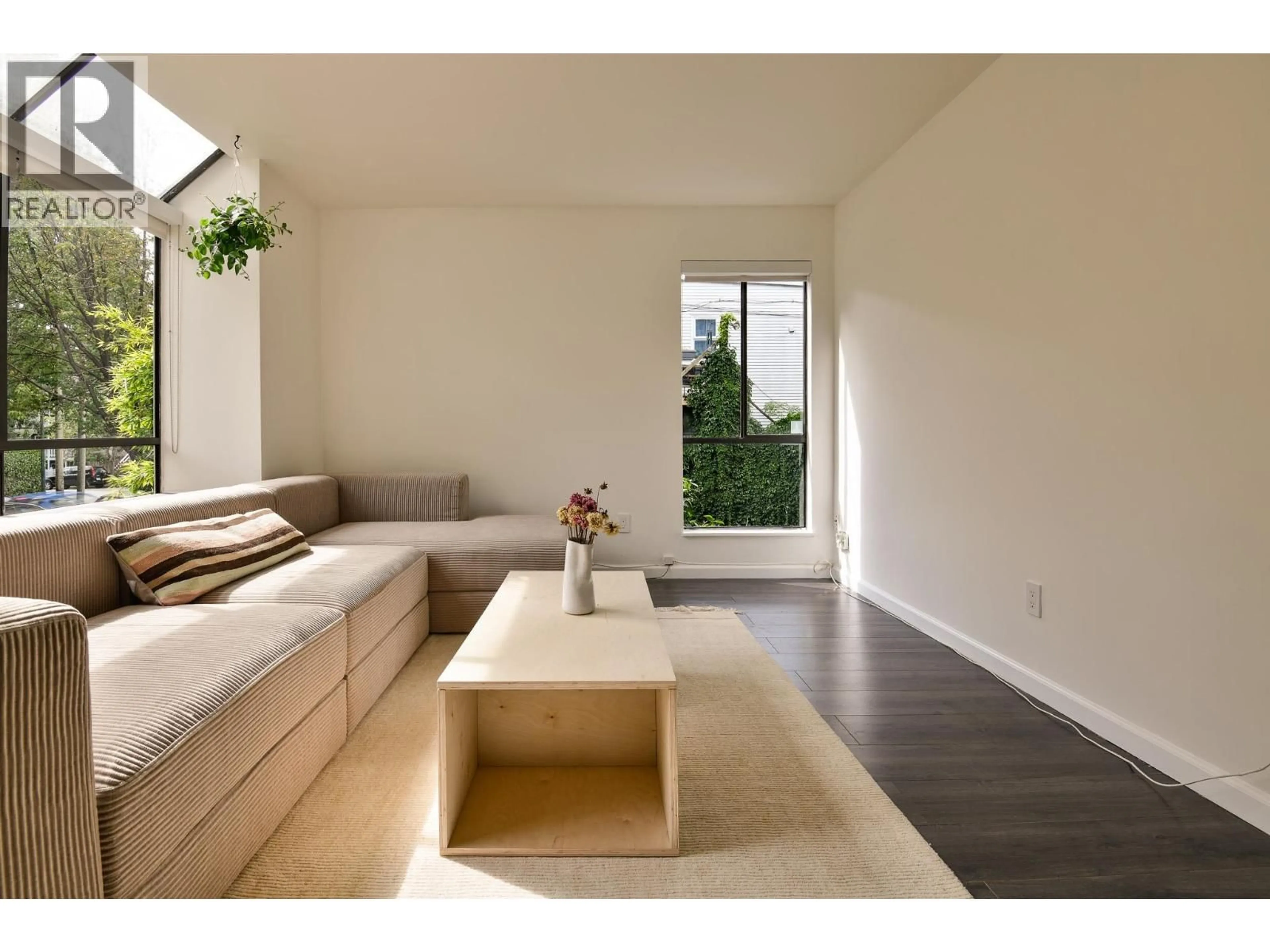 Living room with furniture, wood/laminate floor for 209 - 2173 6 AVENUE, Vancouver British Columbia V6K1V5