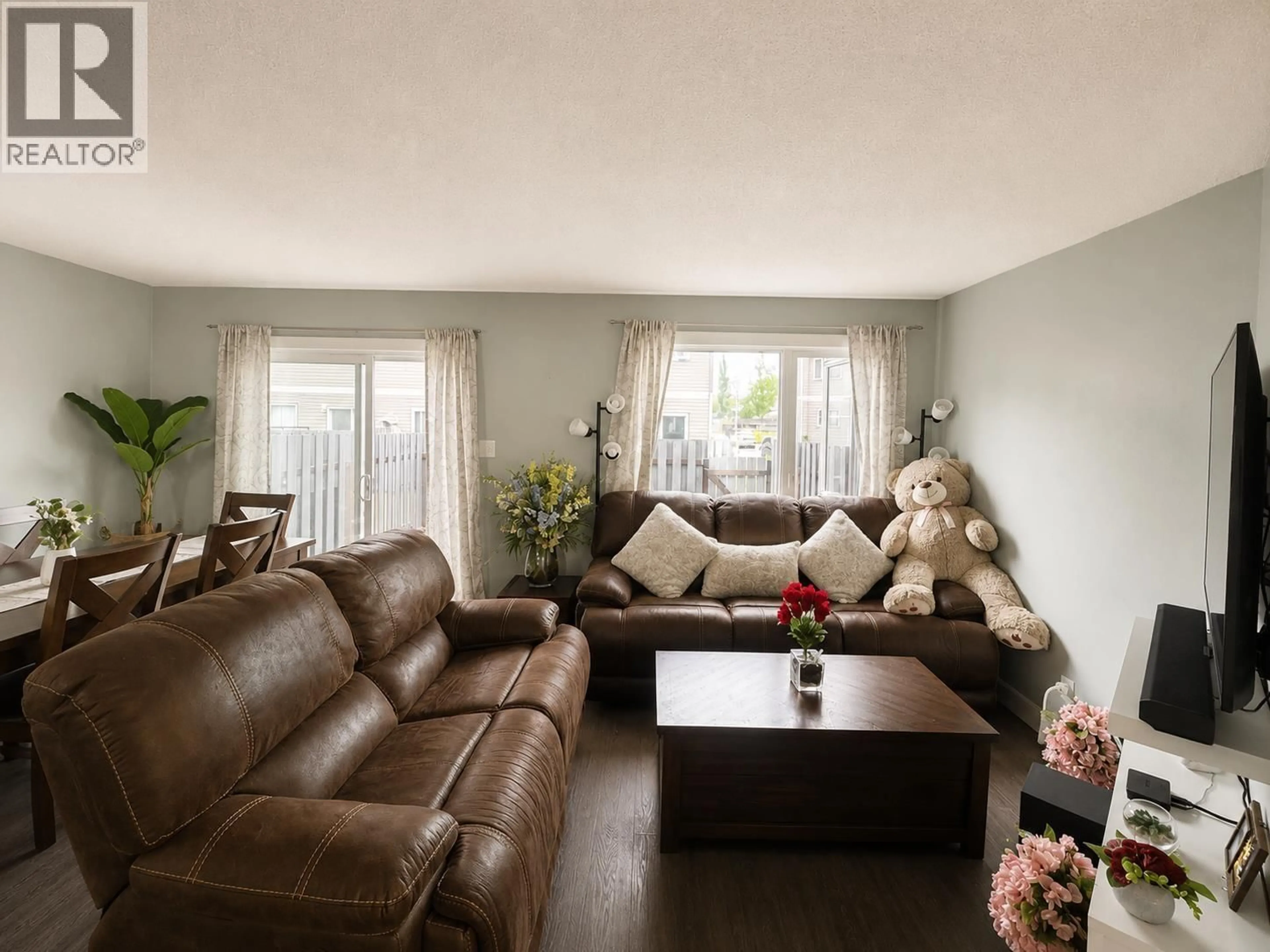 Living room with furniture, wood/laminate floor for 319 - 2550 OSPIKA BOULEVARD, Prince George British Columbia V2N3T2