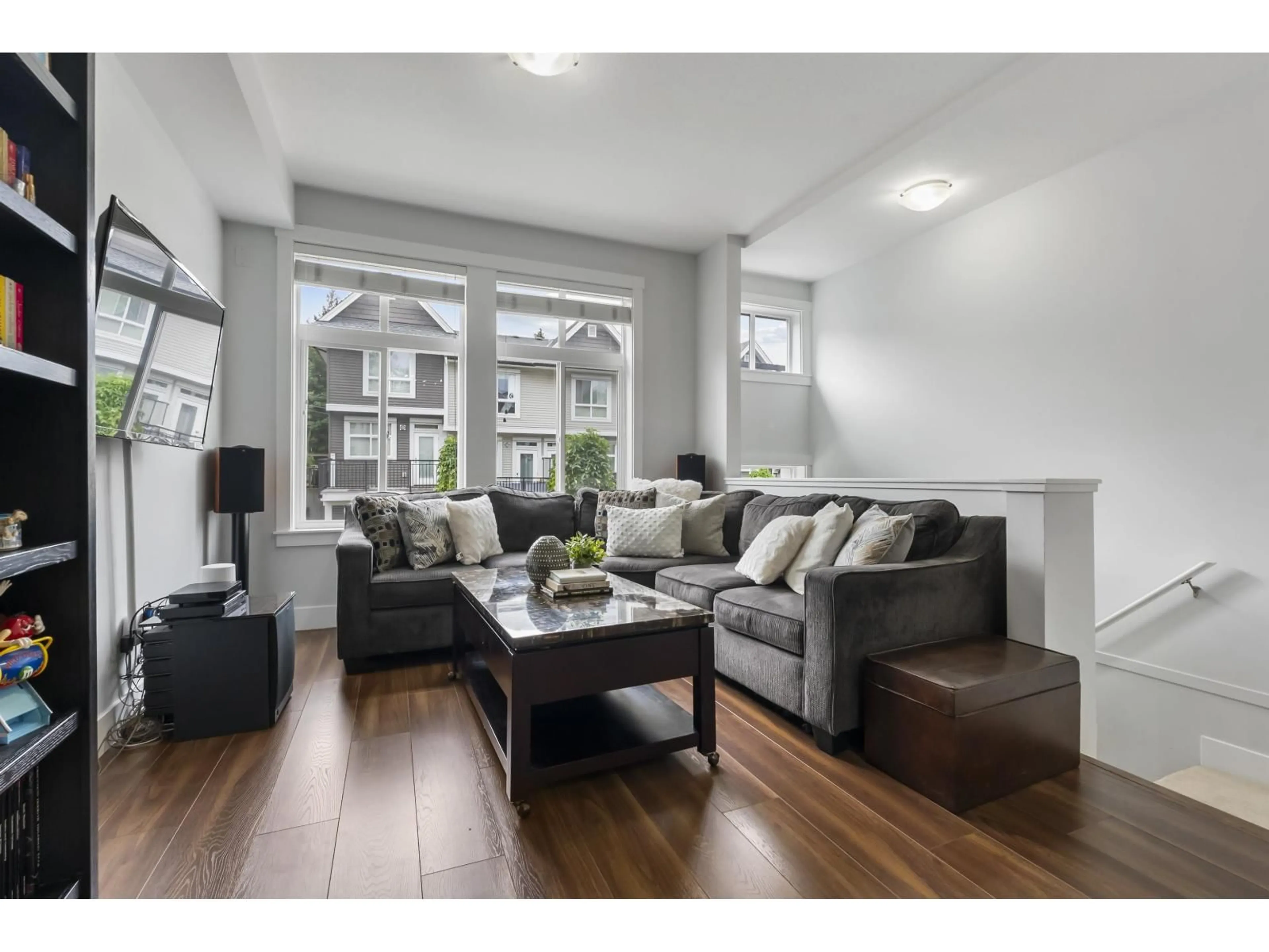 Living room with furniture, wood/laminate floor for 66 - 14433 60 AVENUE, Surrey British Columbia V3S1R4