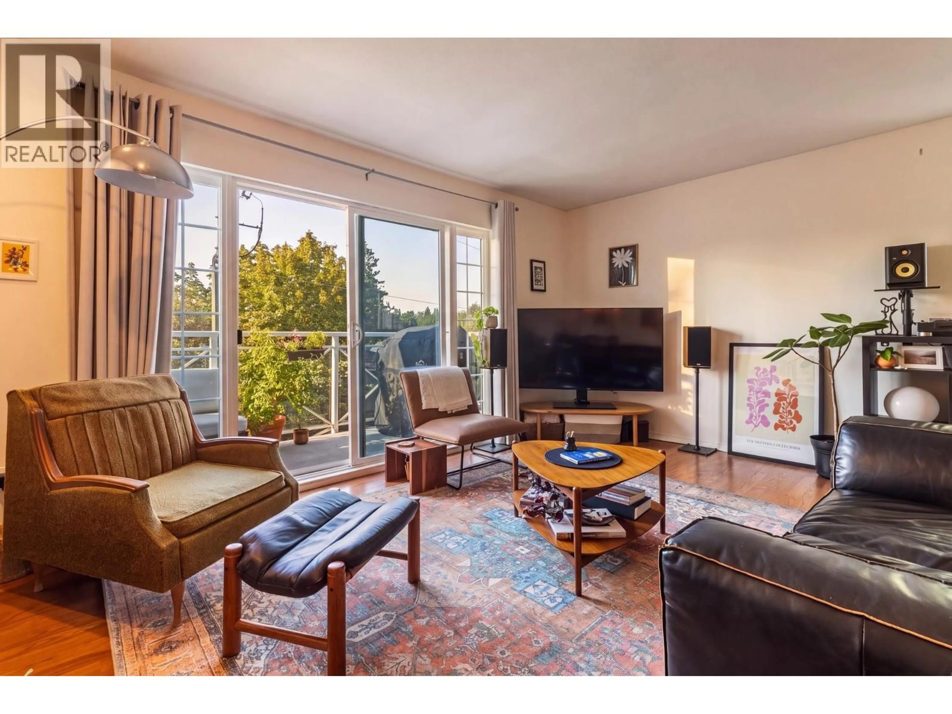 Living room with furniture, wood/laminate floor for 306 - 1868 11TH AVENUE, Vancouver British Columbia V5N1Z1