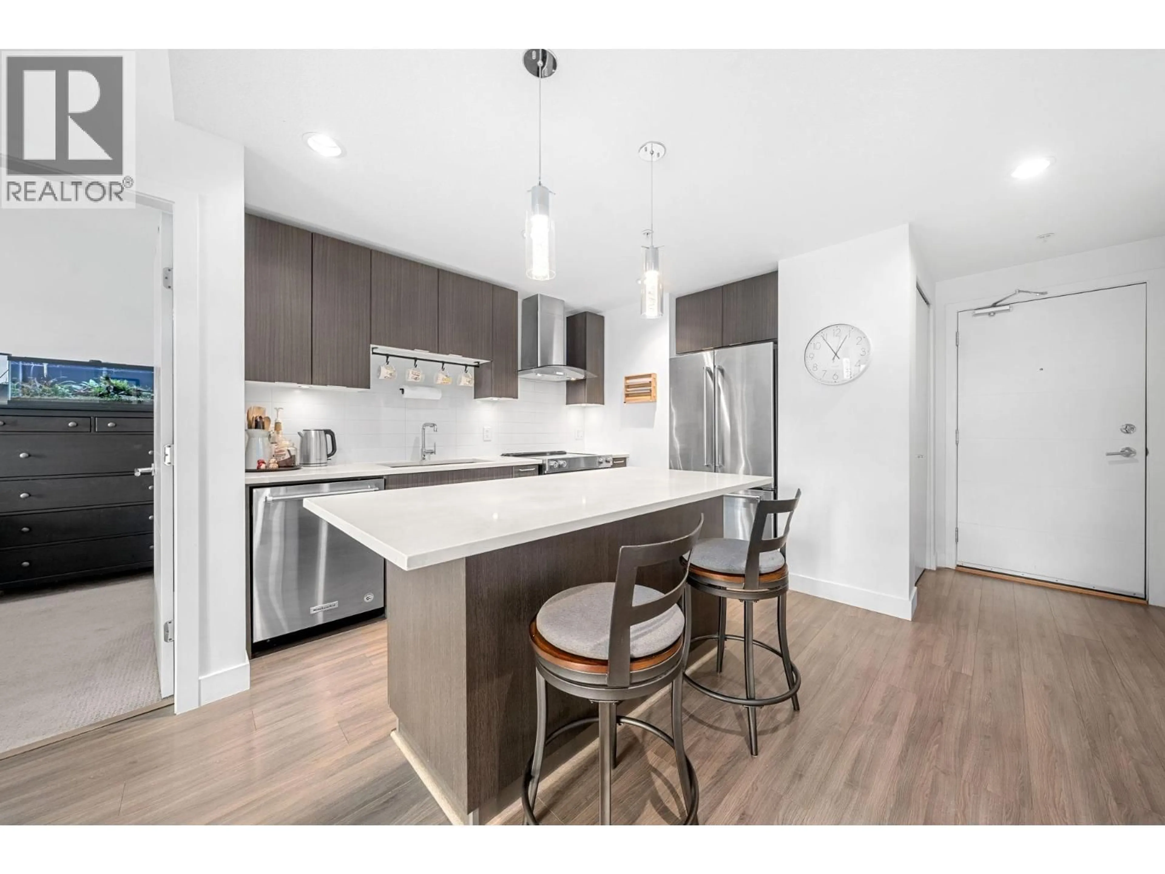 Open concept kitchen, wood/laminate floor for 412 - 719 3RD STREET, North Vancouver British Columbia V7M0E7