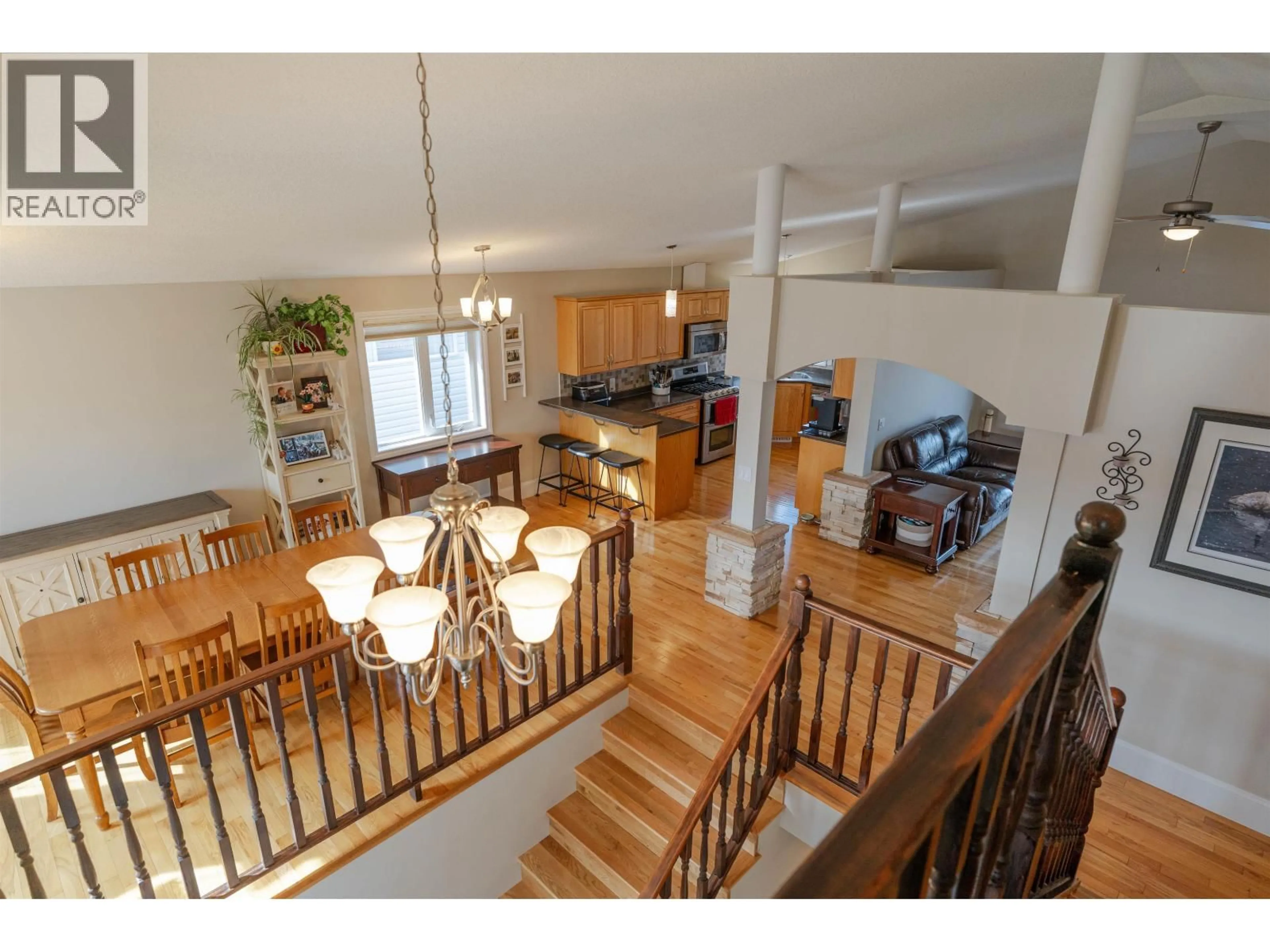 Open concept kitchen, wood/laminate floor for 11332 97 STREET, Fort St. John British Columbia V1J7H8