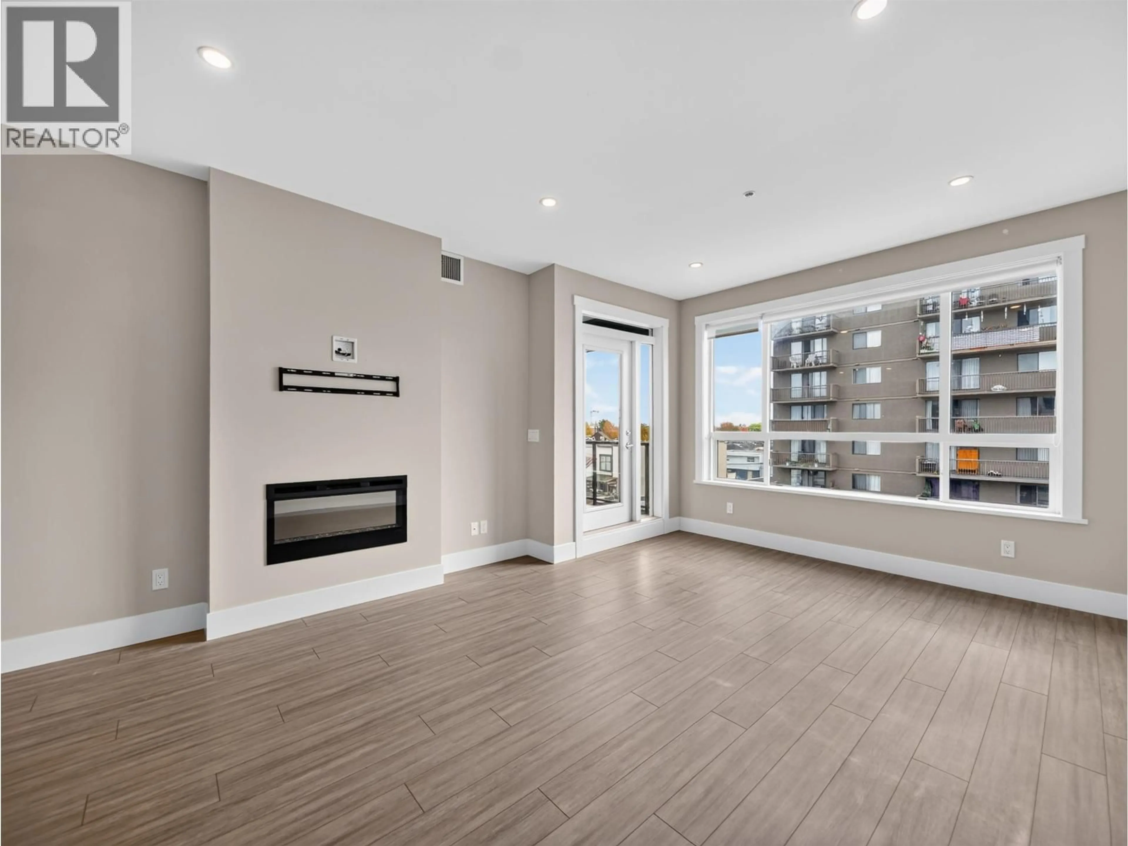 Living room with furniture, wood/laminate floor for 405 - 22335 MCINTOSH AVENUE, Maple Ridge British Columbia V2X3C2