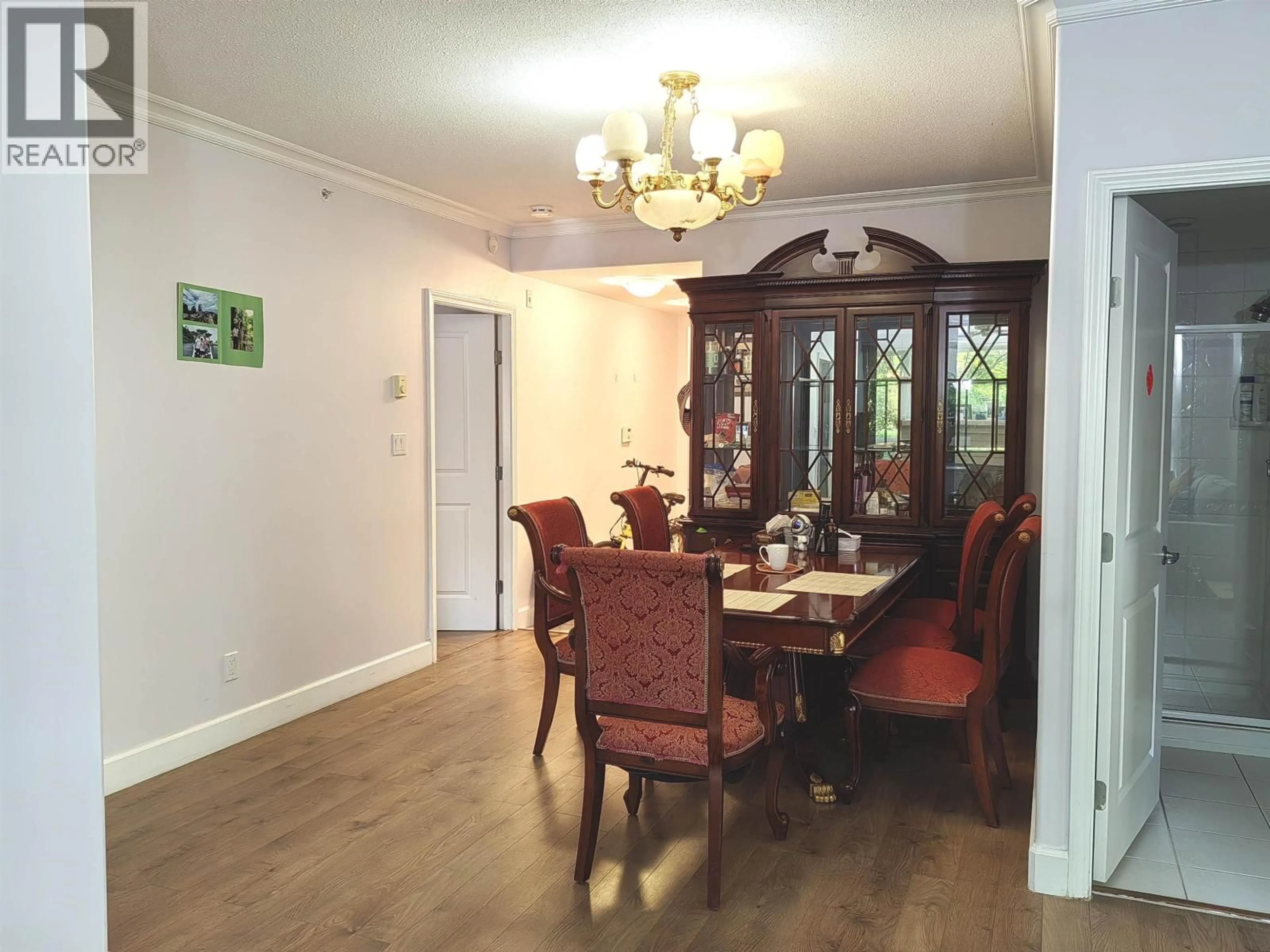 Dining room, wood/laminate floor for 106 - 5770 OAK STREET, Vancouver British Columbia V6M4M5