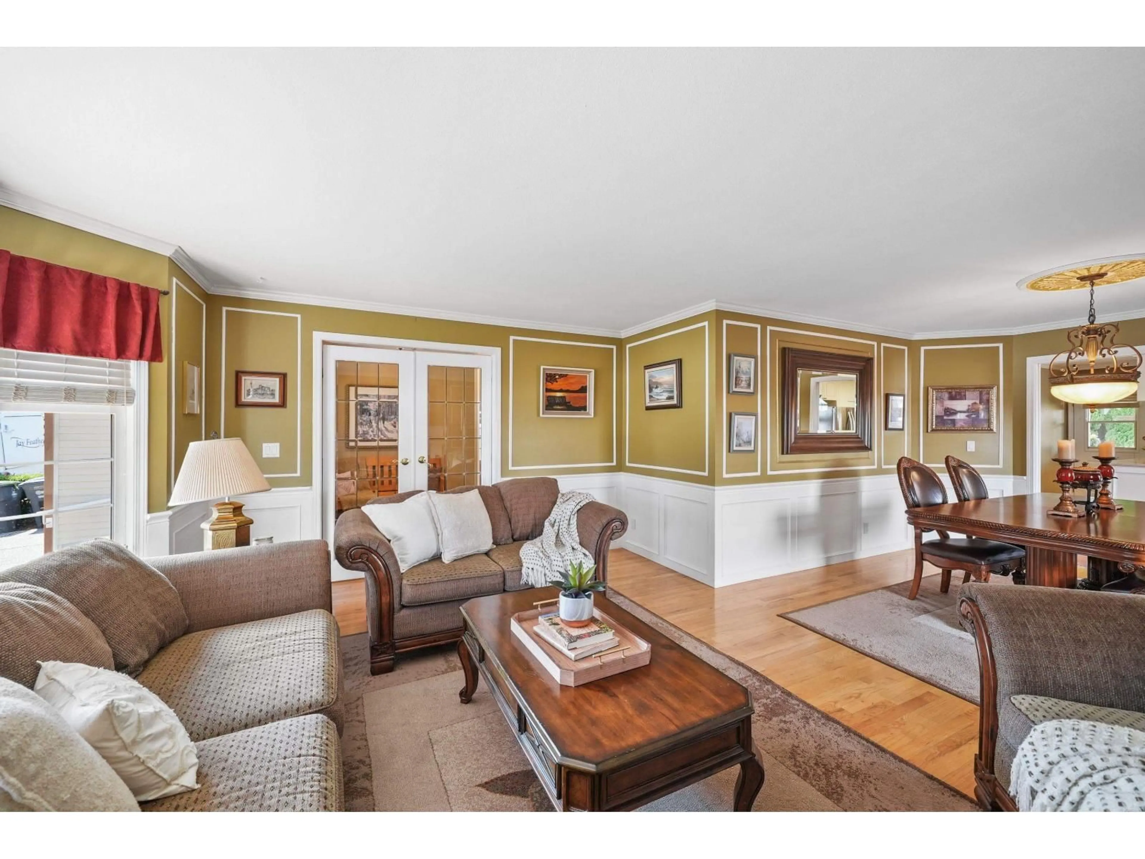 Living room with furniture, wood/laminate floor for 18555 57 AVENUE, Surrey British Columbia V3S7T1
