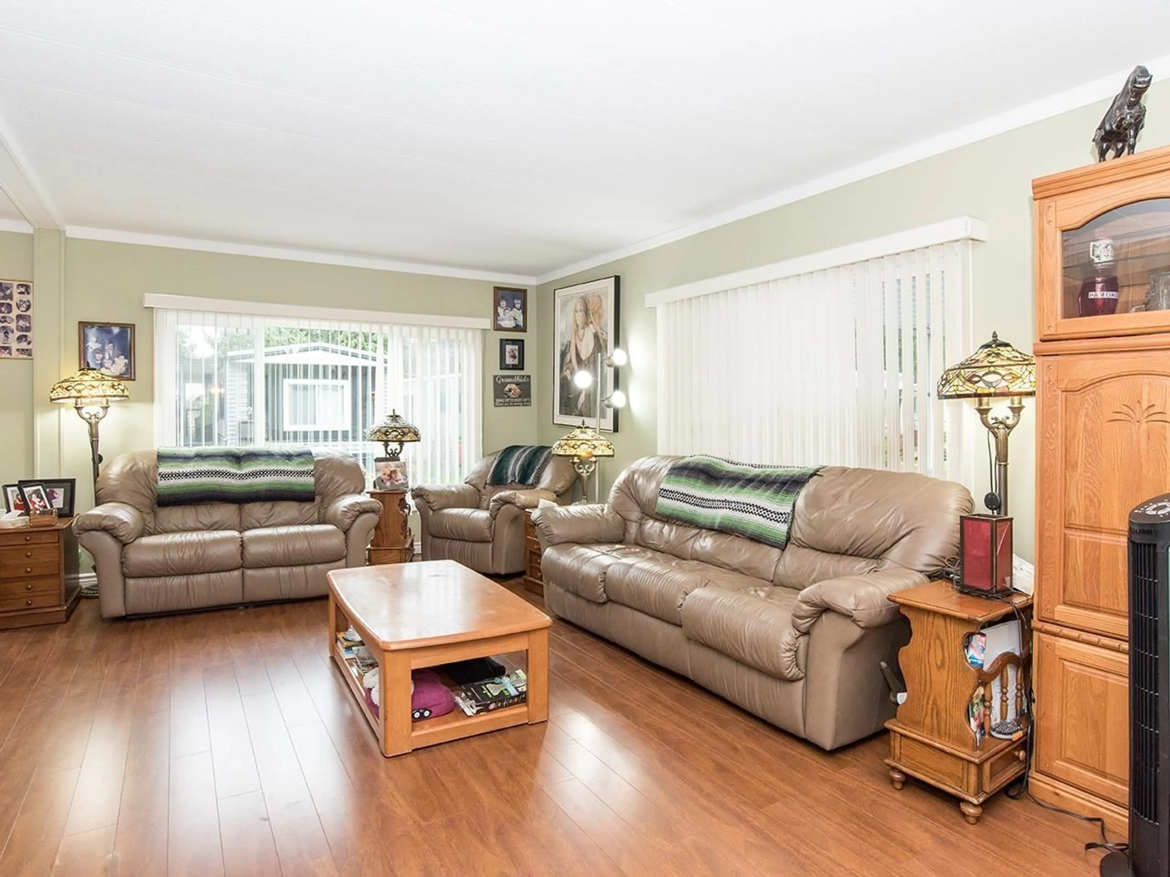 Living room with furniture, wood/laminate floor for 297 - 1840 160 STREET, Surrey British Columbia V4A4X4