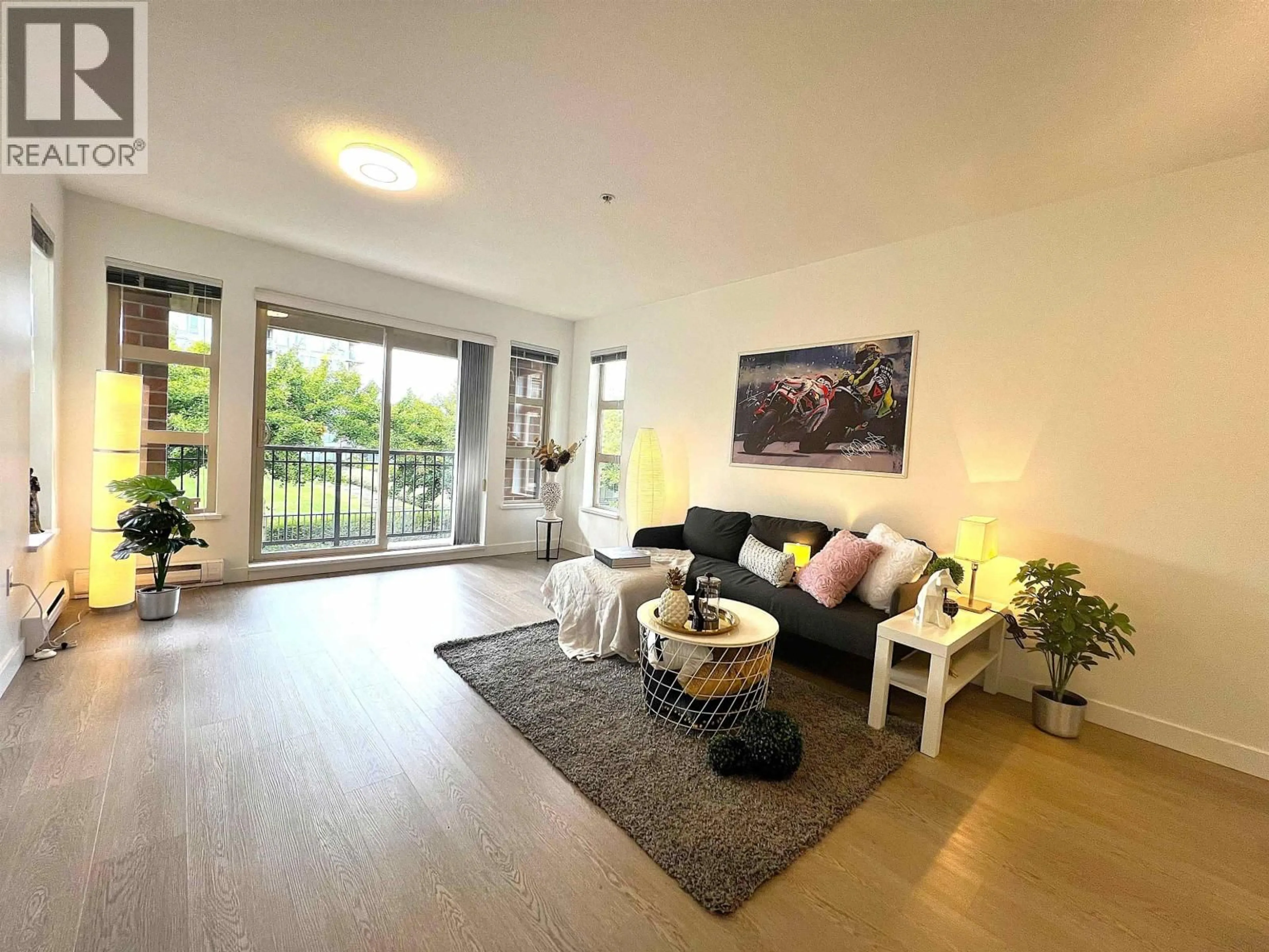 Living room with furniture, wood/laminate floor for 5310 - 5111 GARDEN CITY ROAD, Richmond British Columbia V6X4H4