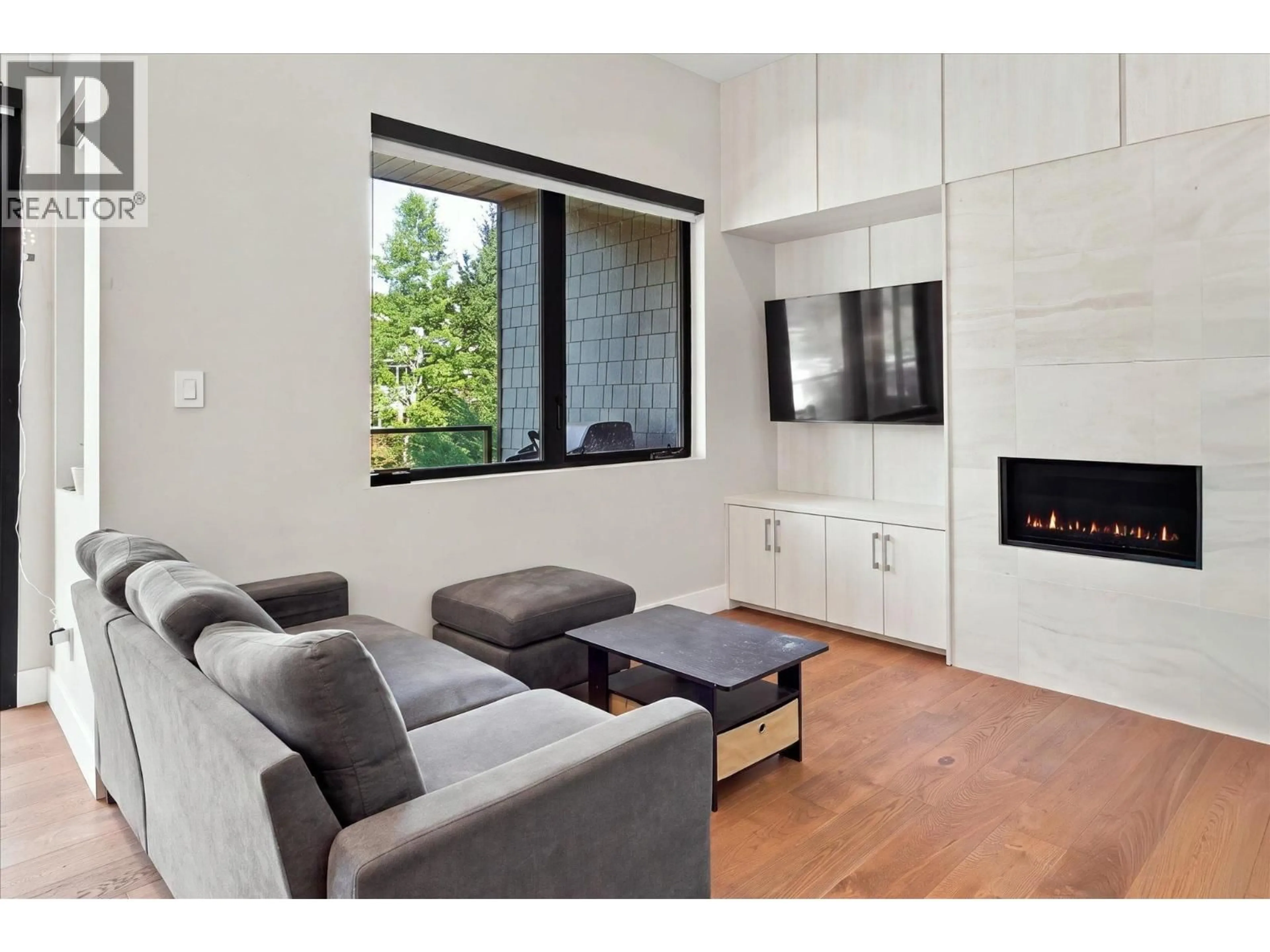 Living room with furniture, wood/laminate floor for 21 - 1350 CLOUDBURST DRIVE, Whistler British Columbia V0N1B1