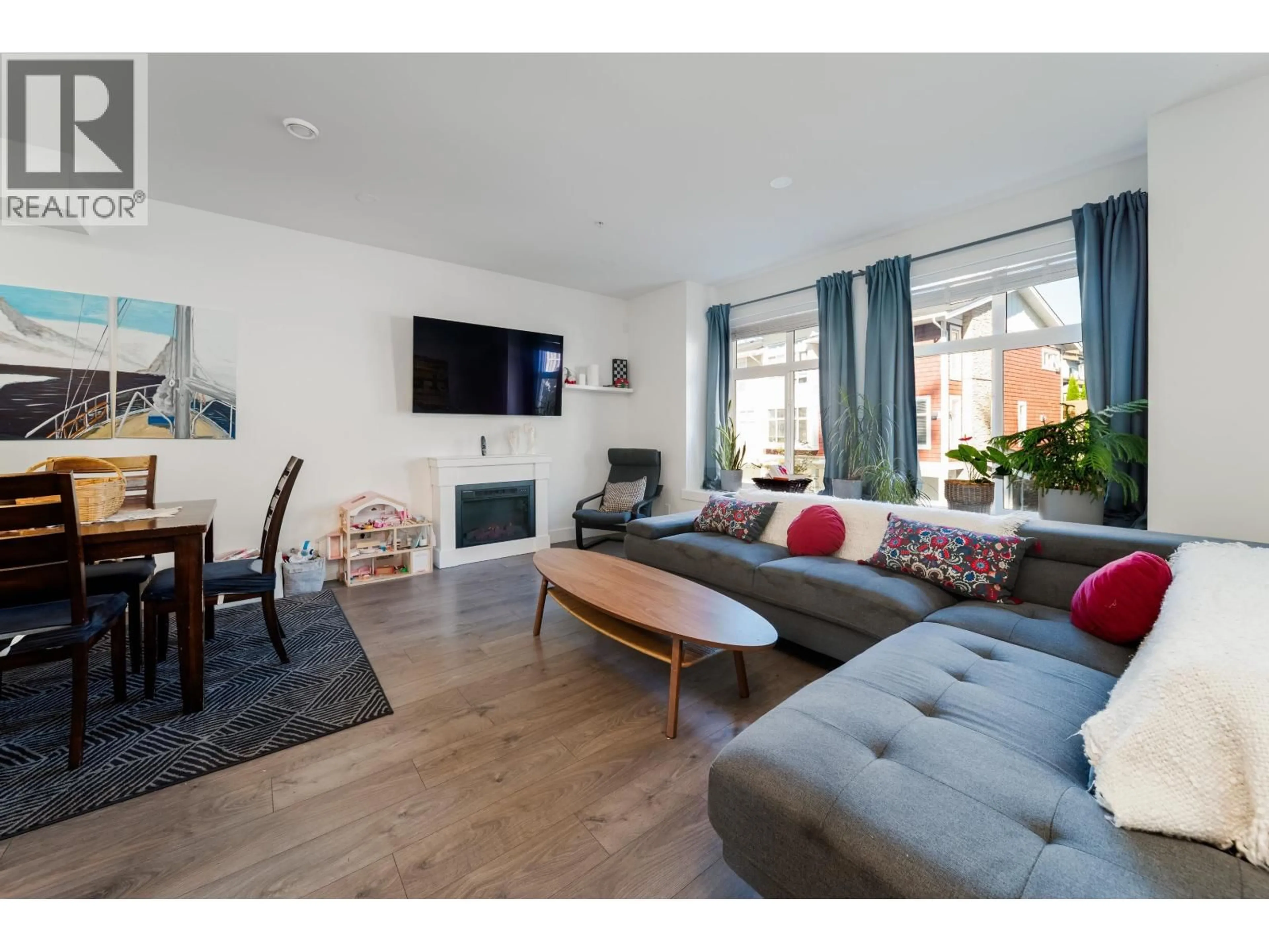 Living room with furniture, wood/laminate floor for 66 - 24108 104 AVENUE, Maple Ridge British Columbia V2W0J5
