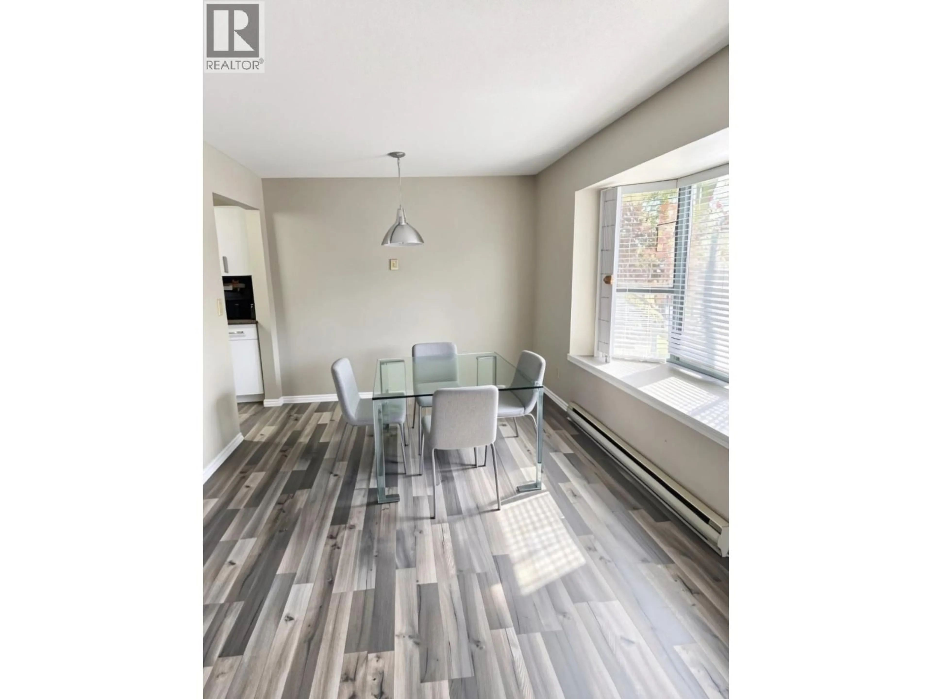 Dining room, wood/laminate floor for 109 - 5250 VICTORY STREET, Burnaby British Columbia V5J5H2