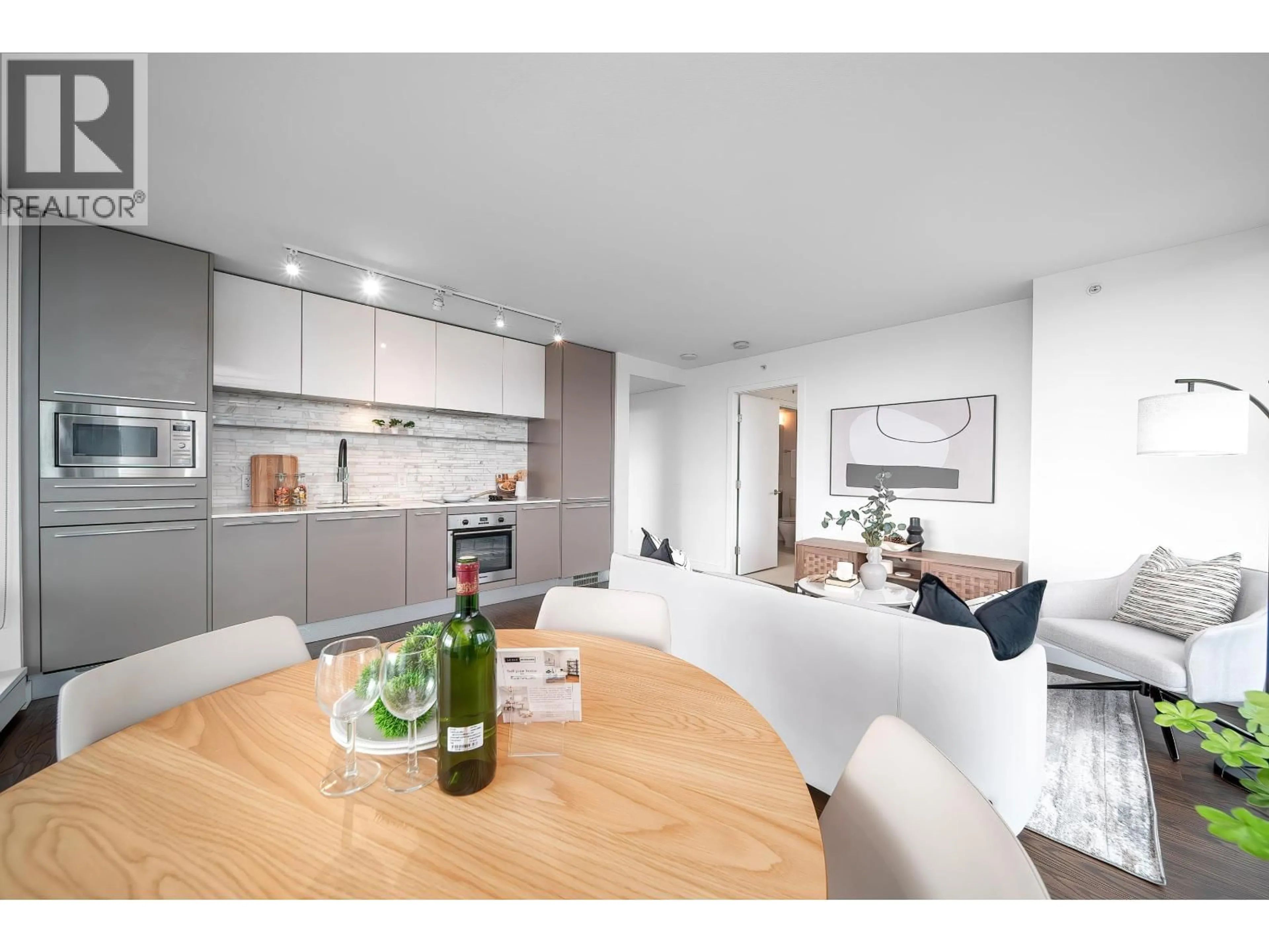 Open concept kitchen, wood/laminate floor for 904 - 8131 NUNAVUT LANE, Vancouver British Columbia V5X0E2
