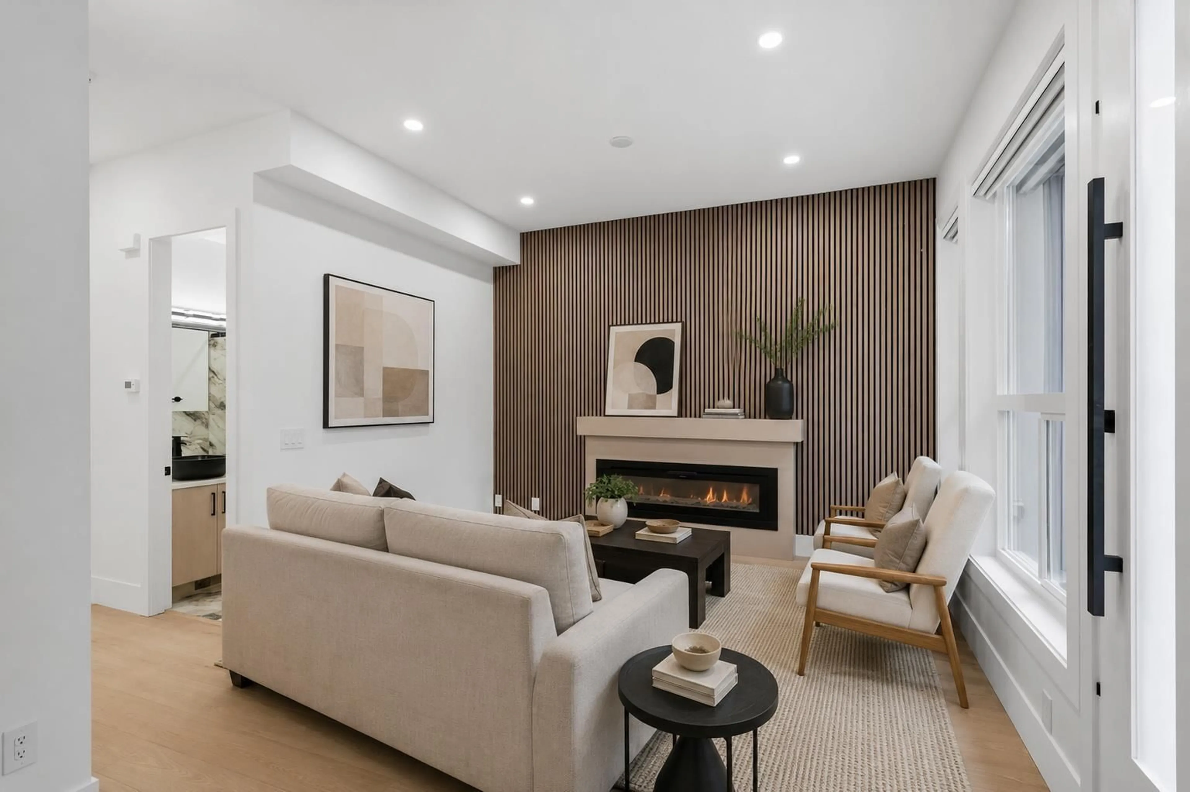 Living room with furniture, wood/laminate floor for 101 - 12873 MARINE DRIVE, Surrey British Columbia V4A1C8