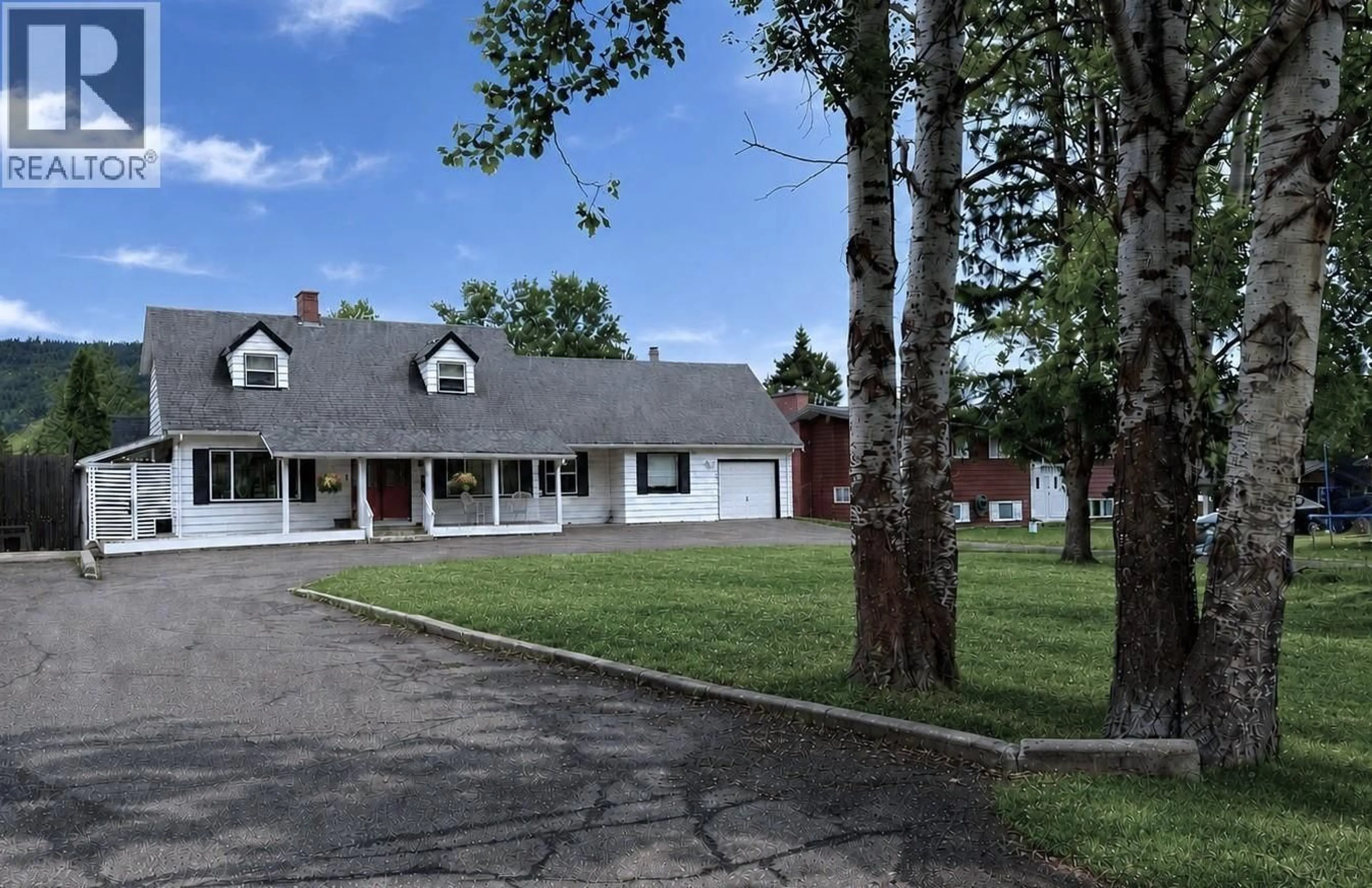 A pic from outside/outdoor area/front of a property/back of a property/a pic from drone, street for 255 EVERGREEN CRESCENT, 100 Mile House British Columbia V0K2E0
