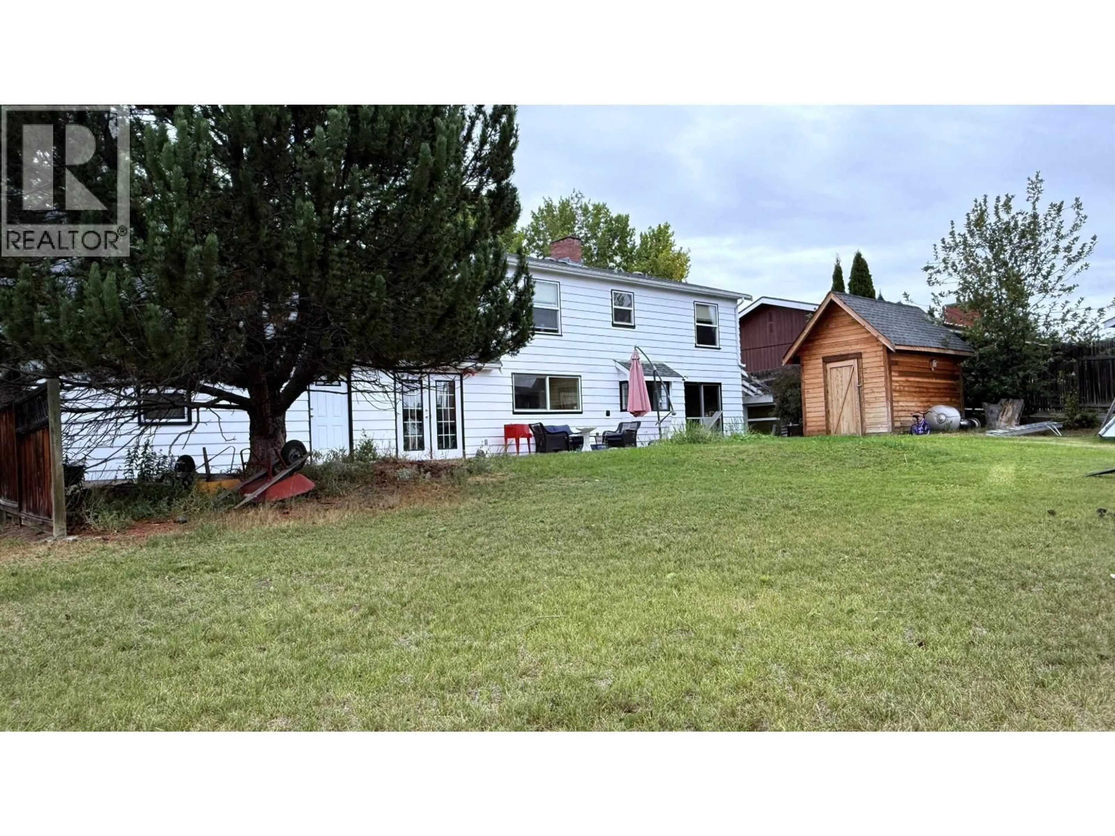 A pic from outside/outdoor area/front of a property/back of a property/a pic from drone, mountain view for 255 EVERGREEN CRESCENT, 100 Mile House British Columbia V0K2E0