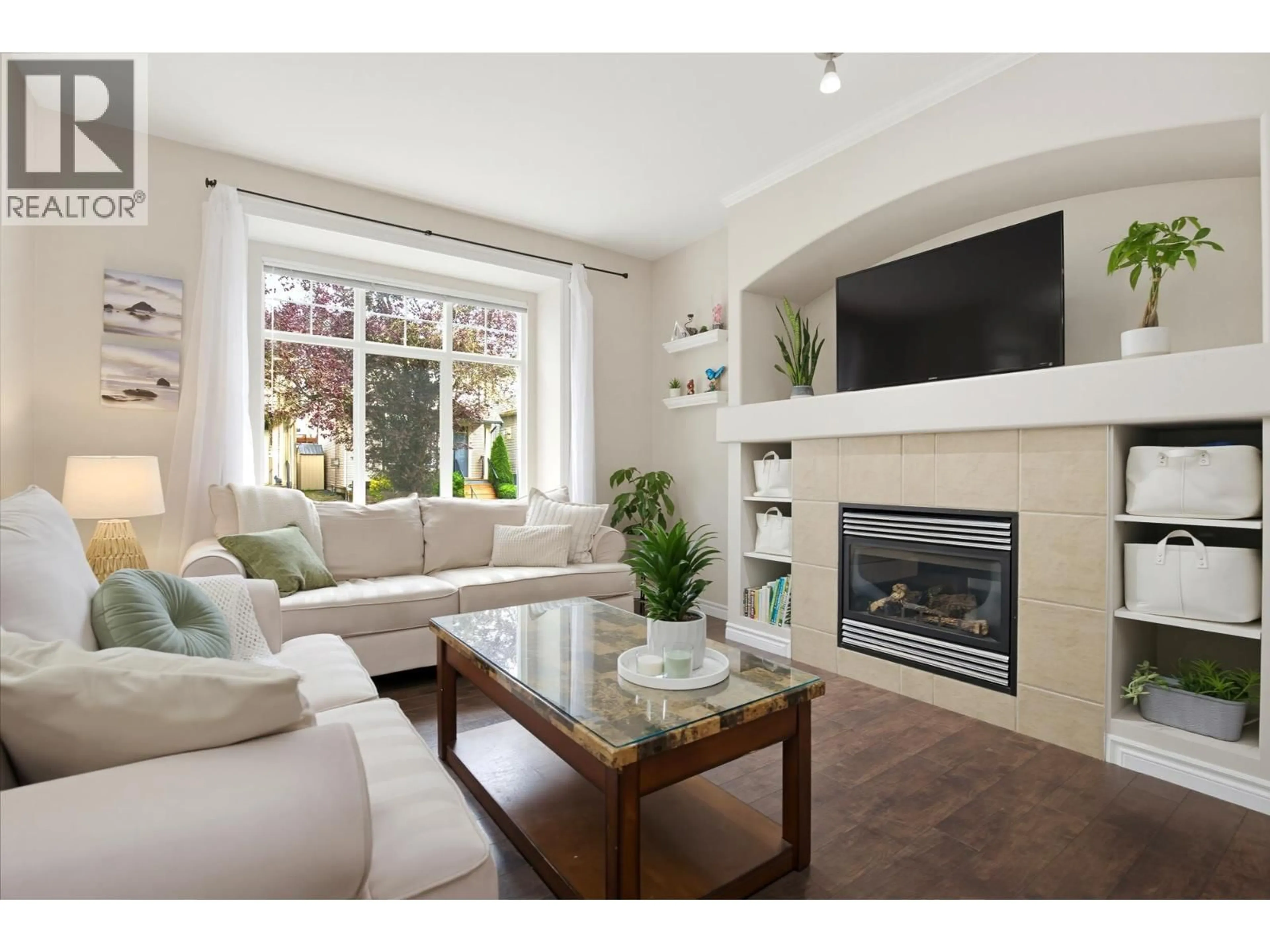 Living room with furniture, wood/laminate floor for 24360 102A AVENUE, Maple Ridge British Columbia V2W2E3