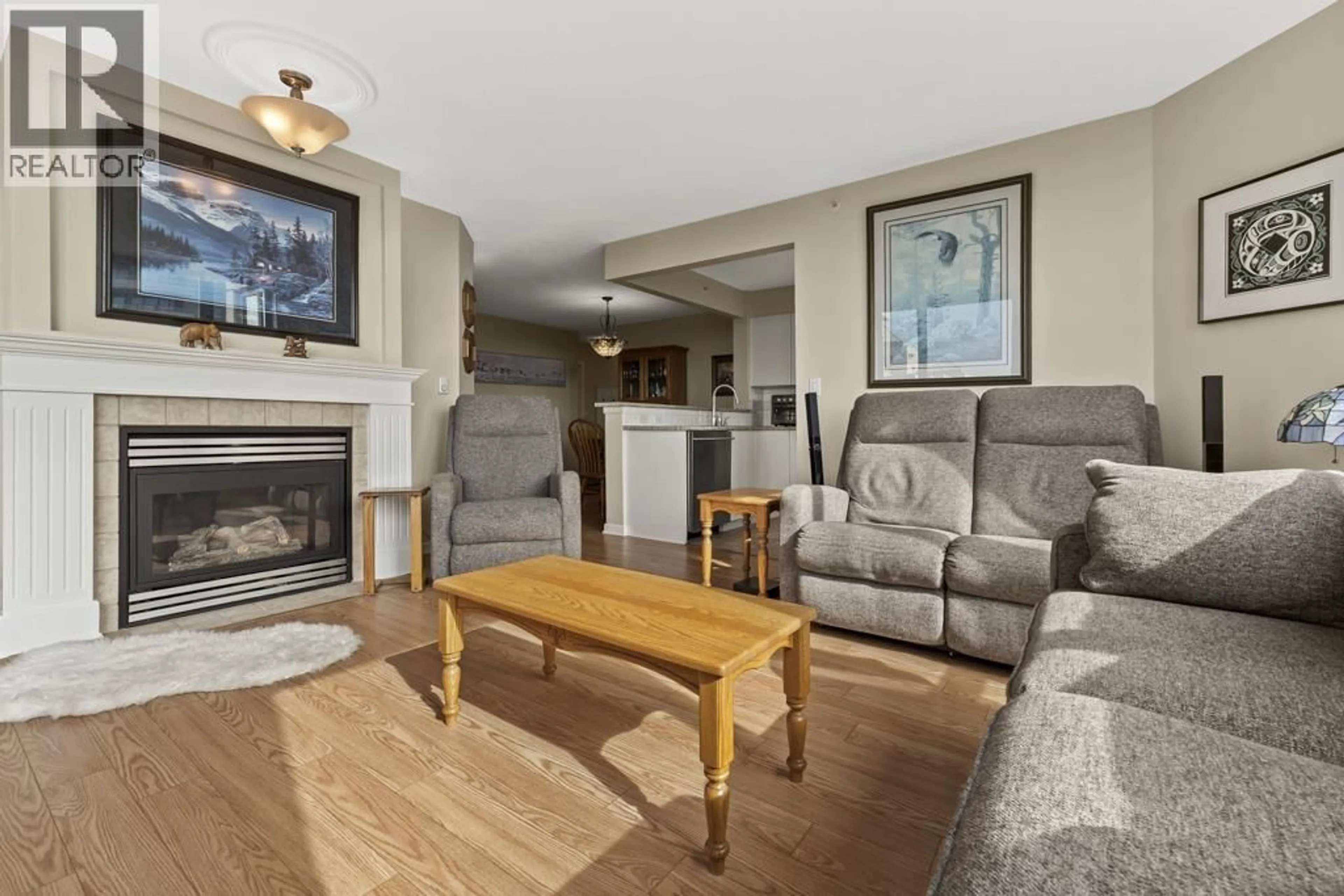 Living room with furniture, wood/laminate floor for 1703 - 6611 SOUTHOAKS CRESCENT, Burnaby British Columbia V5E4L5