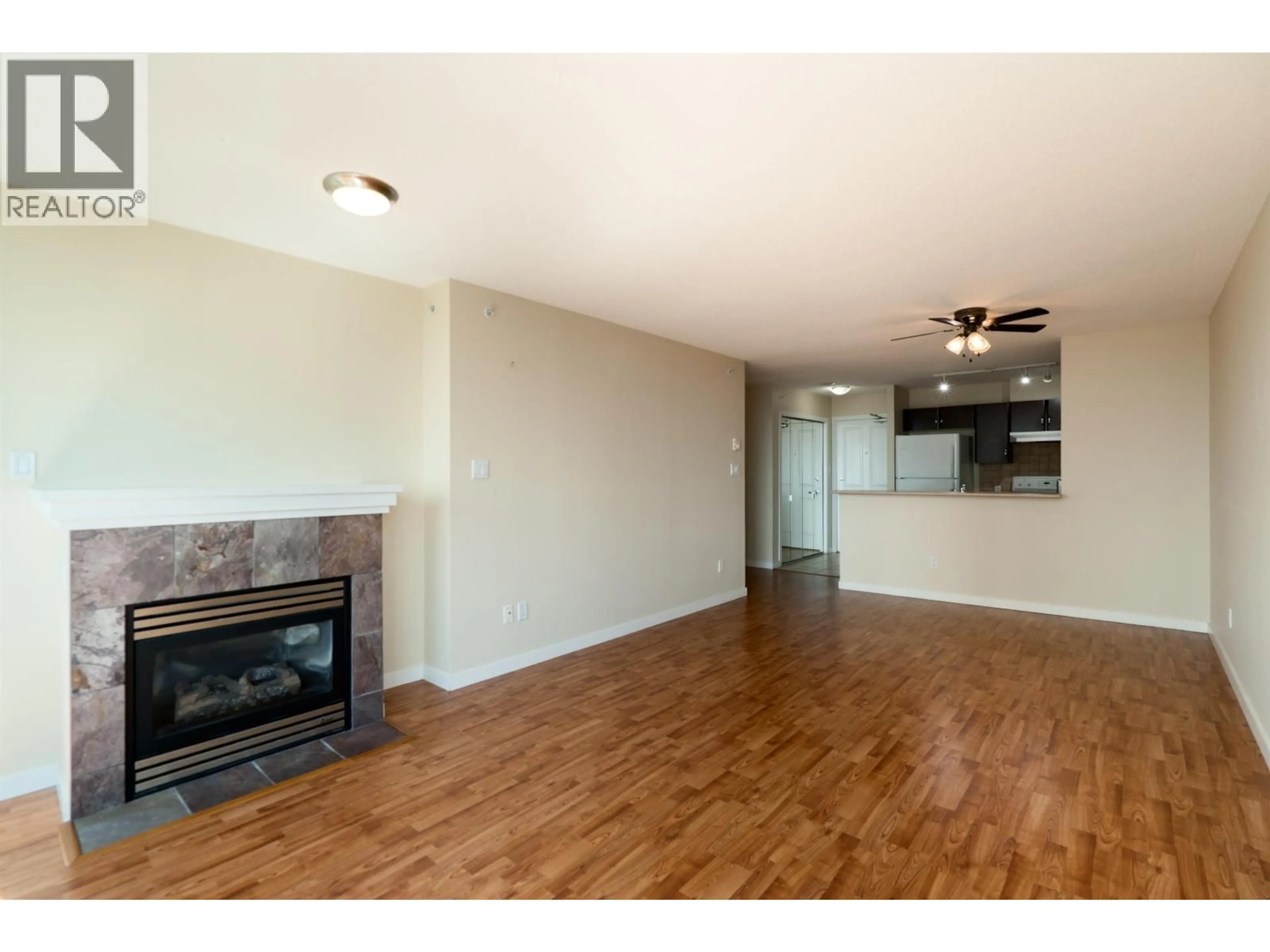 Living room with furniture, wood/laminate floor for 1105 - 6659 SOUTHOAKS CRESCENT, Burnaby British Columbia V5E4M9