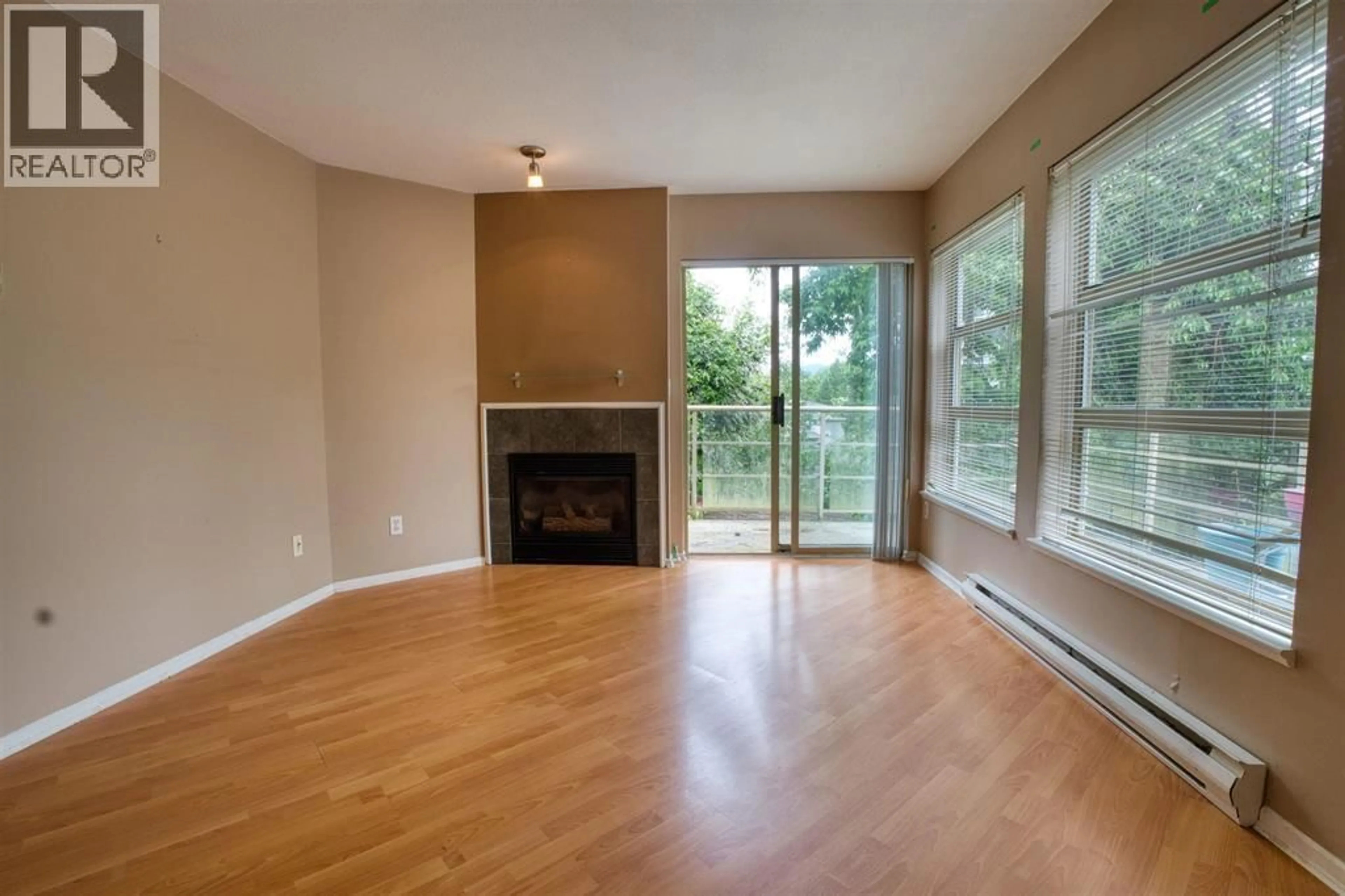 Living room with furniture, wood/laminate floor for 206 - 22277 122 AVENUE, Maple Ridge British Columbia V2X3X8