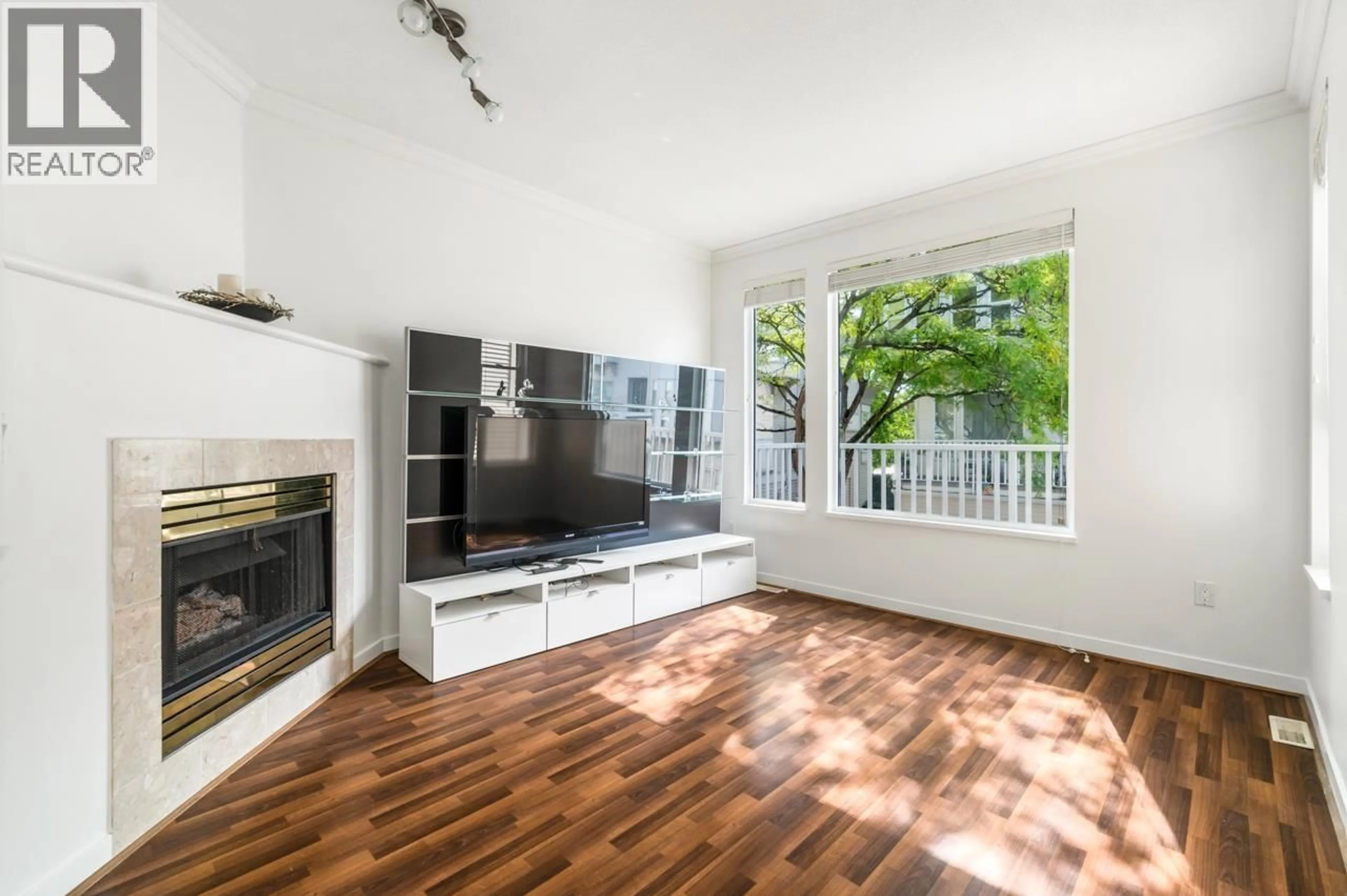 Living room with furniture, wood/laminate floor for 6 - 12311 MCNEELY DRIVE, Richmond British Columbia V6V2S2