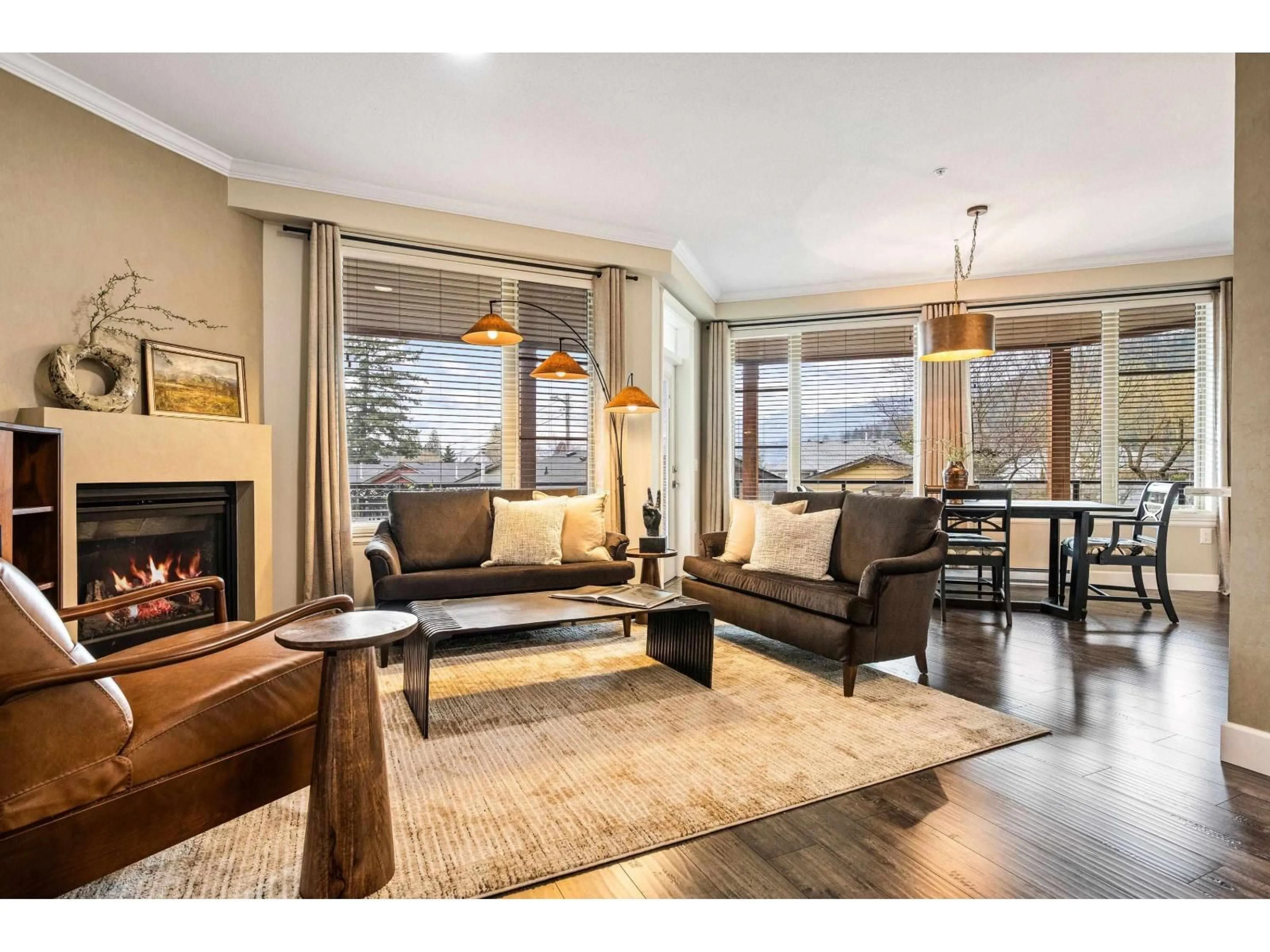 Living room with furniture, wood/laminate floor for 210 - 45754 KEITH WILSON ROAD, Chilliwack British Columbia V2R6A9