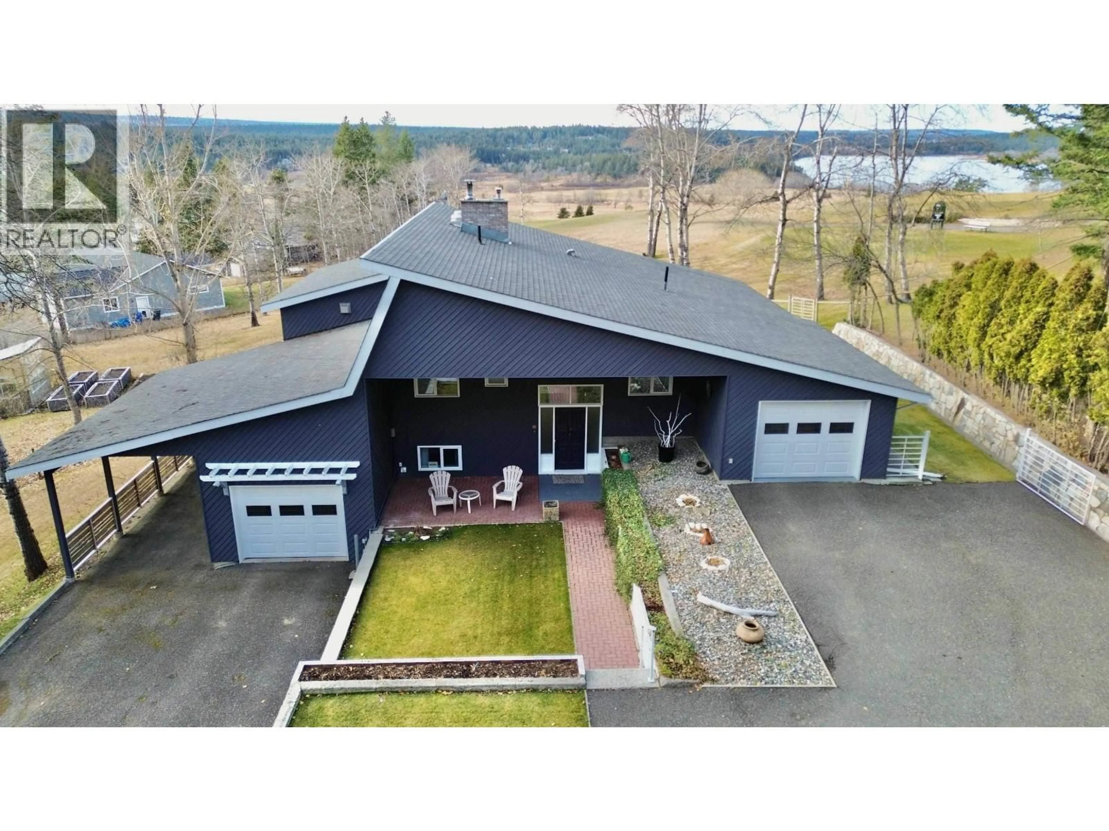 A pic from outside/outdoor area/front of a property/back of a property/a pic from drone, building for 4838 TELQUA DRIVE, 108 Mile Ranch British Columbia V0K2Z0