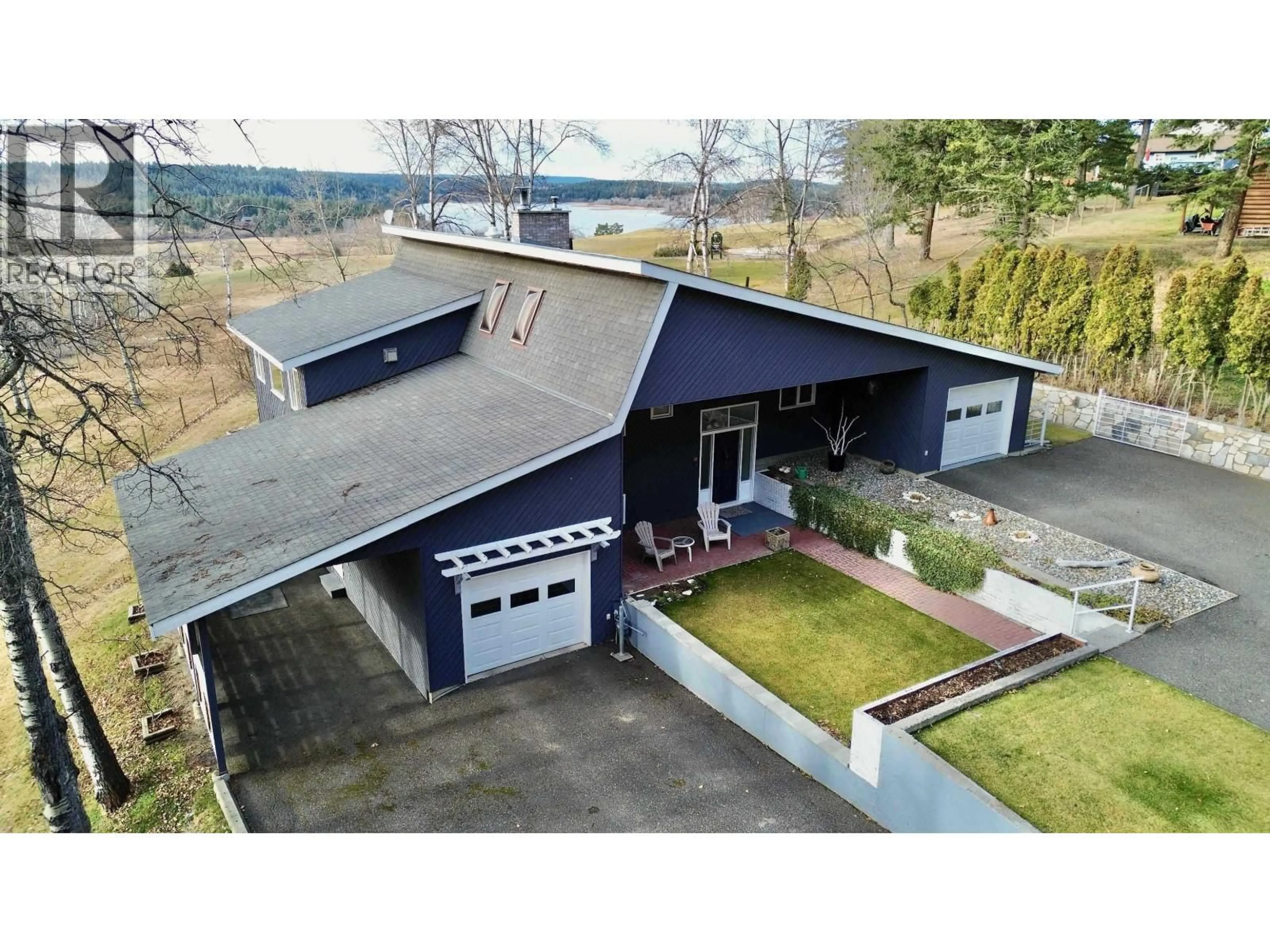A pic from outside/outdoor area/front of a property/back of a property/a pic from drone, building for 4838 TELQUA DRIVE, 108 Mile Ranch British Columbia V0K2Z0