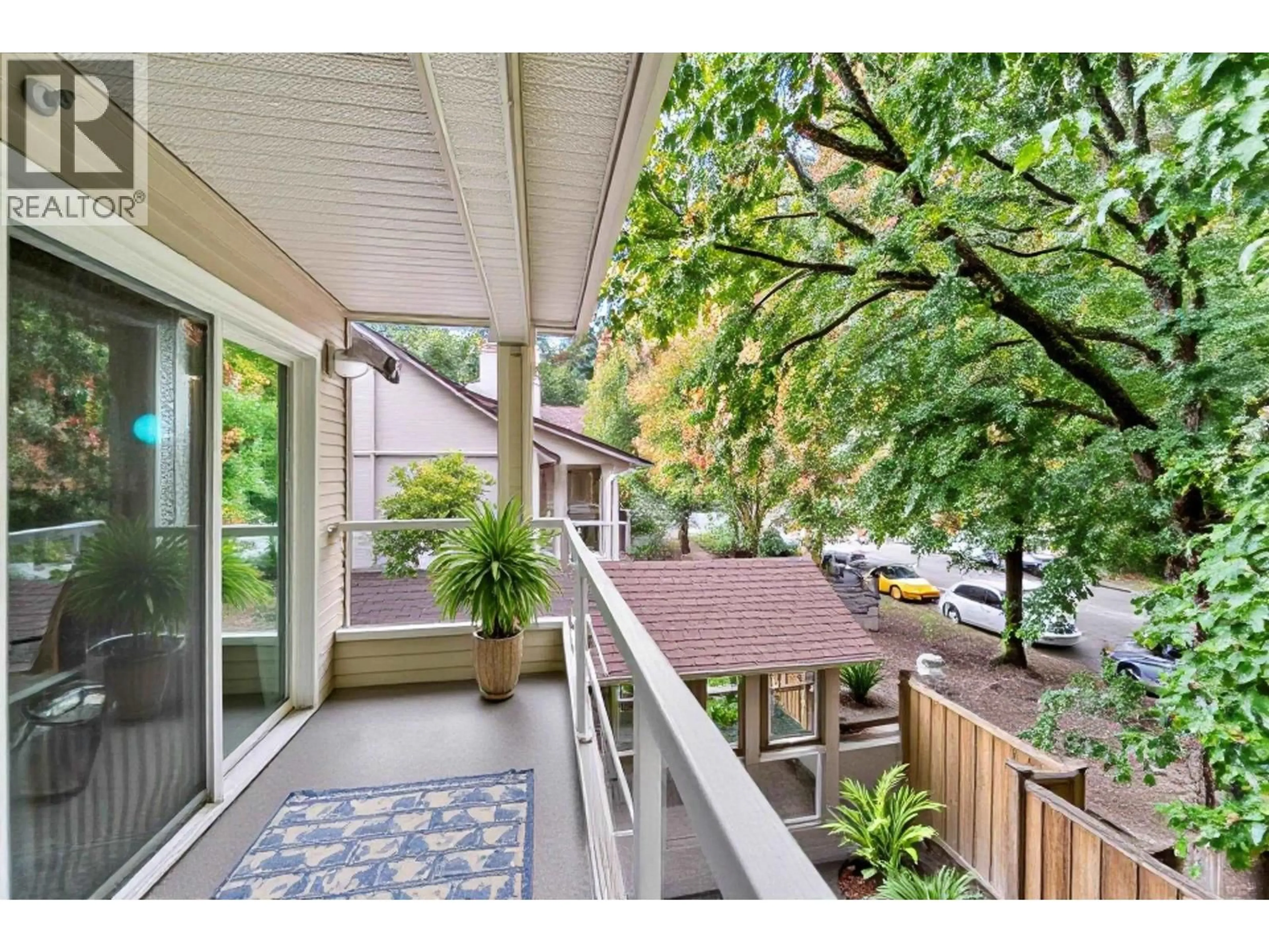 Patio, city buildings view from balcony for 306 - 3400 MARINR DRIVE, Vancouver British Columbia V5S4P8