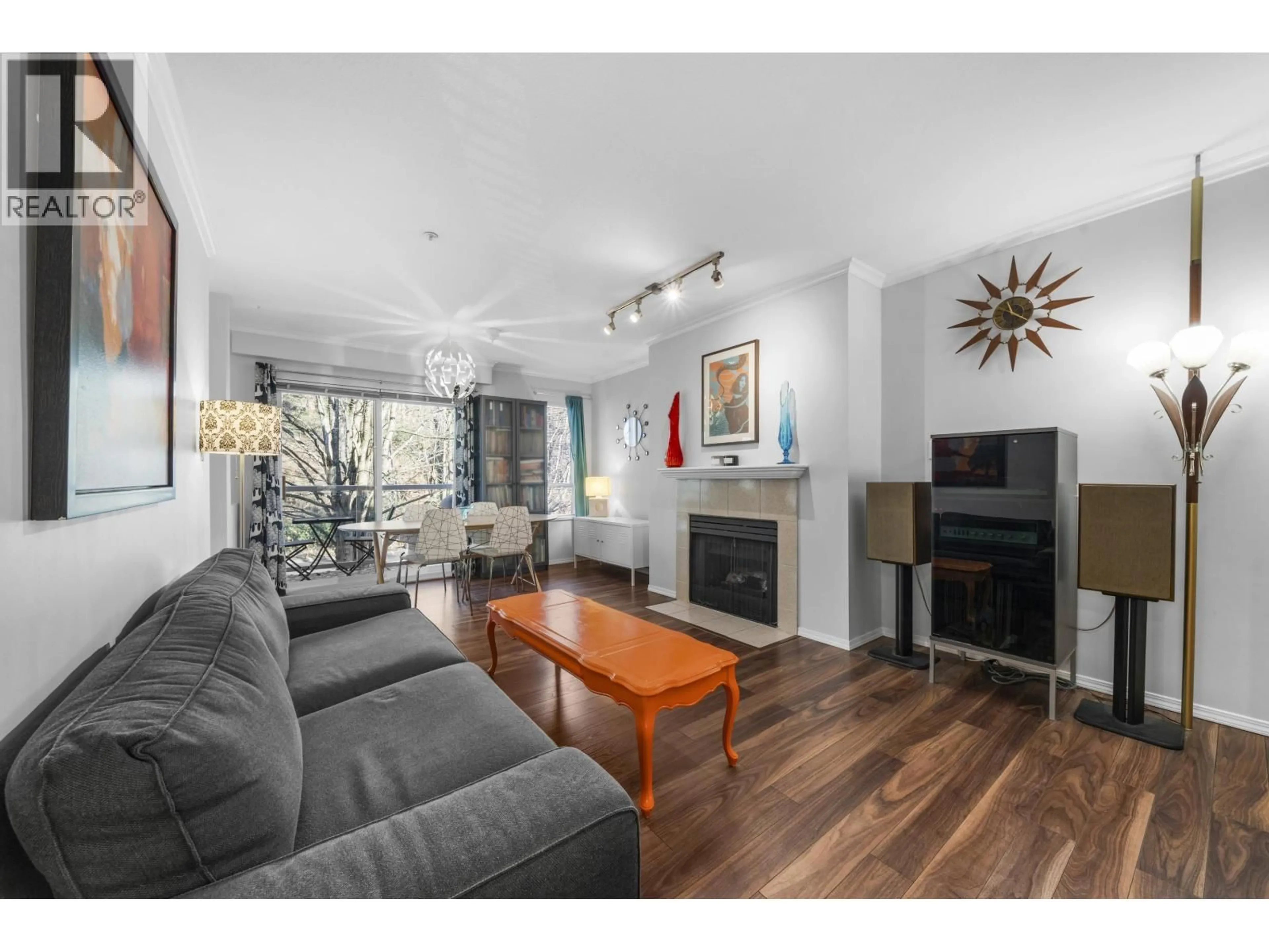 Living room with furniture, wood/laminate floor for 306 - 3400 MARINR DRIVE, Vancouver British Columbia V5S4P8