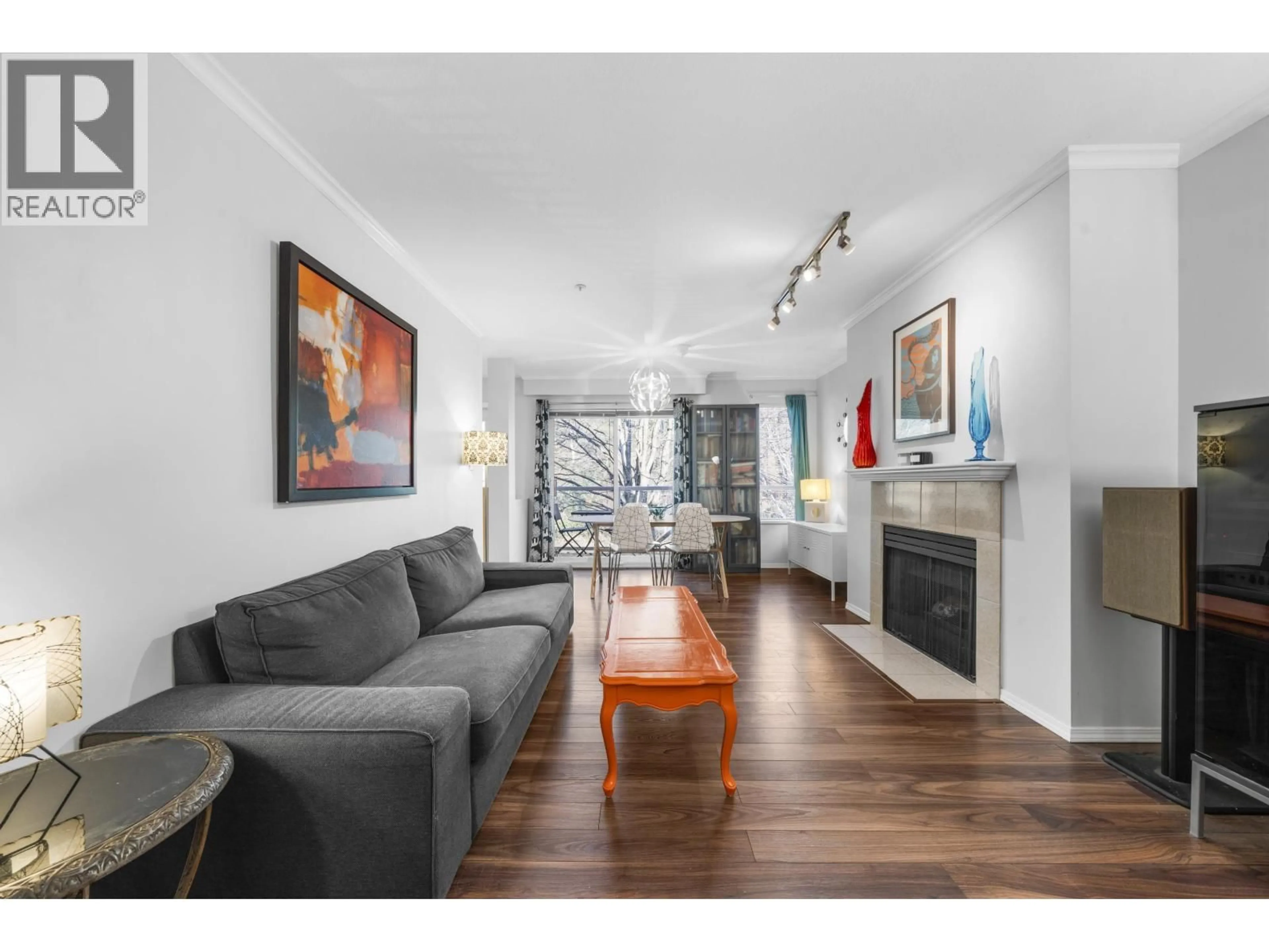 Living room with furniture, wood/laminate floor for 306 - 3400 MARINR DRIVE, Vancouver British Columbia V5S4P8
