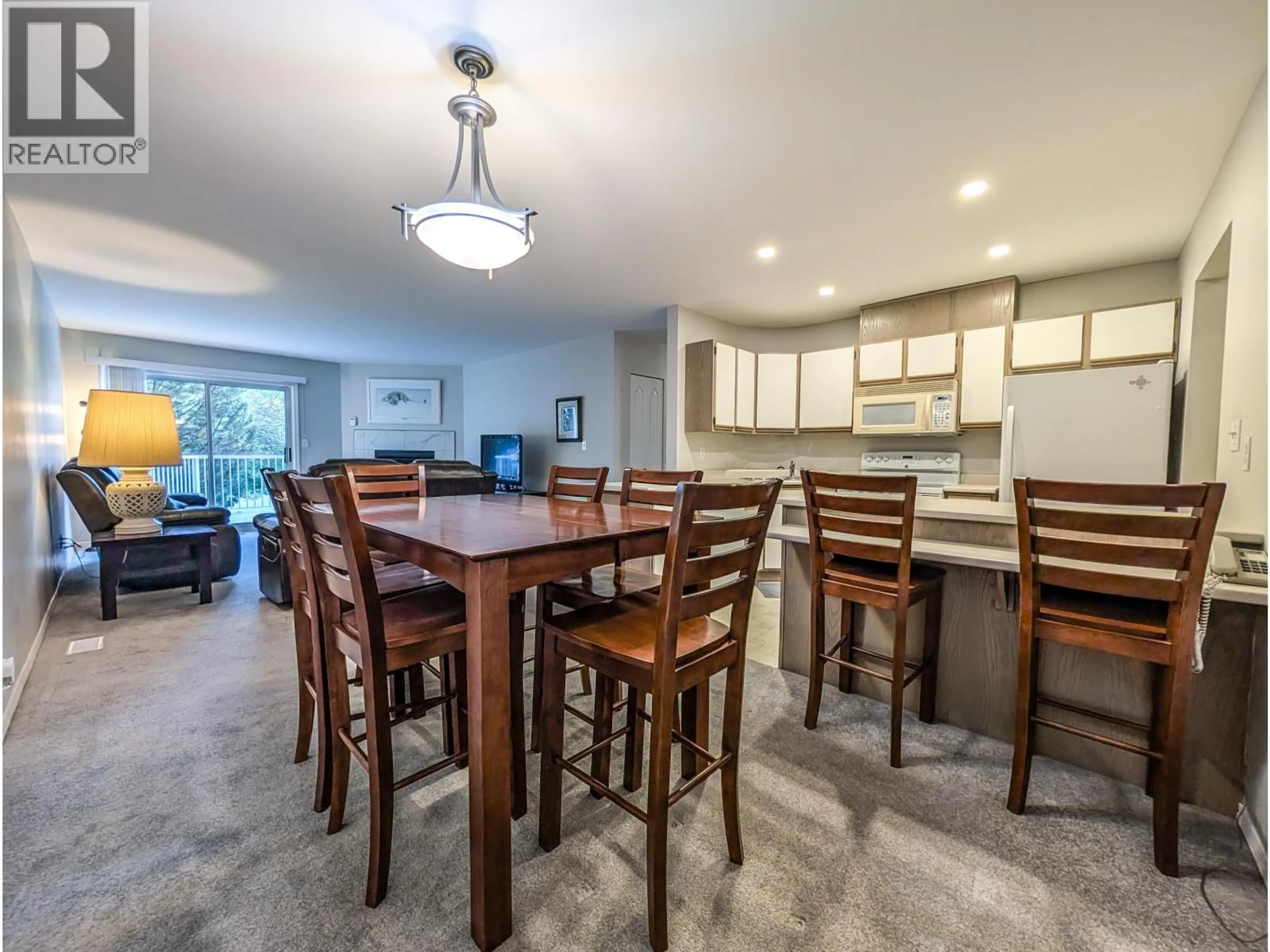 Open concept kitchen, wood/laminate floor for 105 - 7255 SOUTHRIDGE AVENUE, Prince George British Columbia V2N4Z3