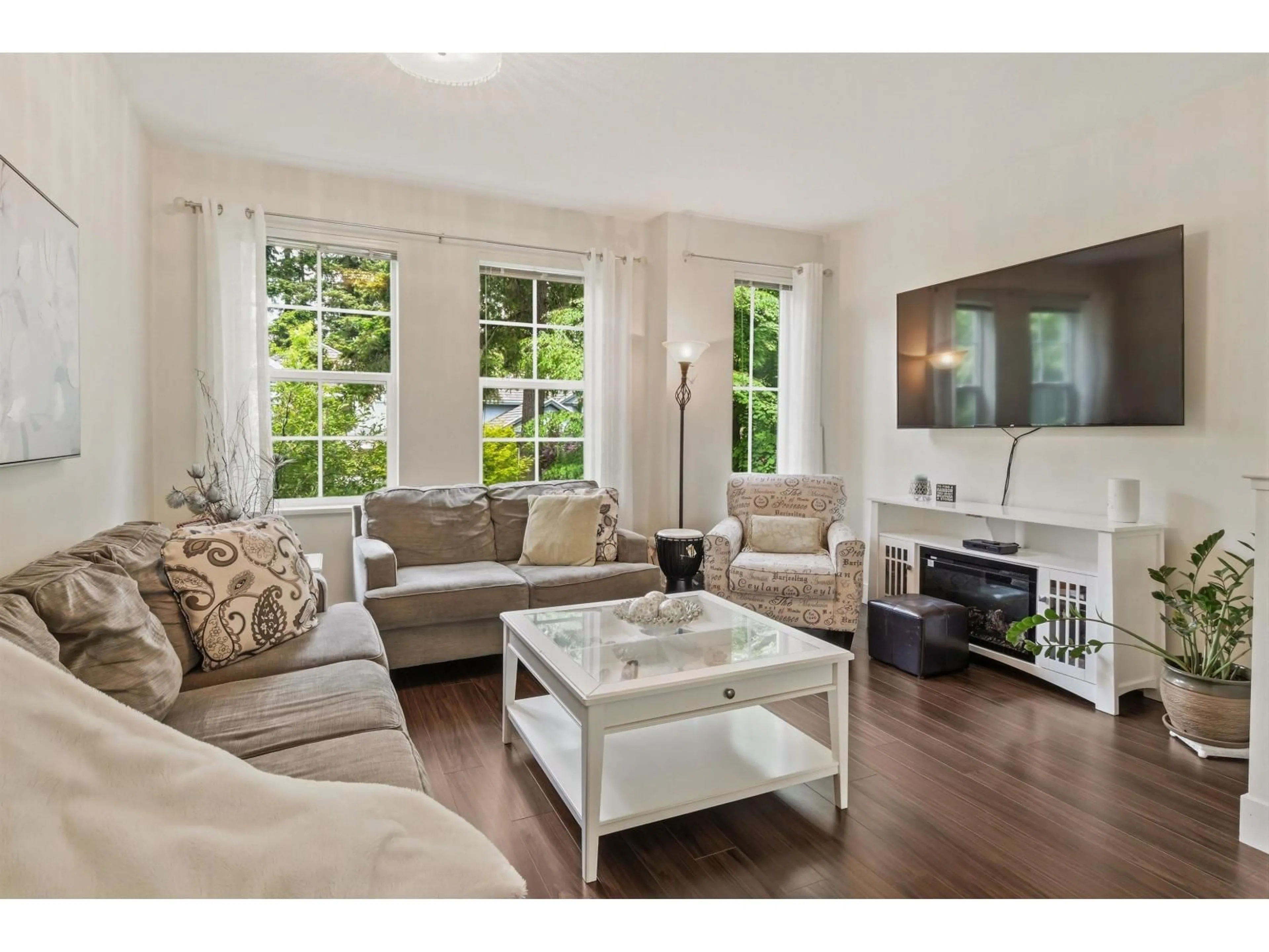 Living room with furniture, wood/laminate floor for 20 - 3399 151ST STREET, Surrey British Columbia V3Z0L3