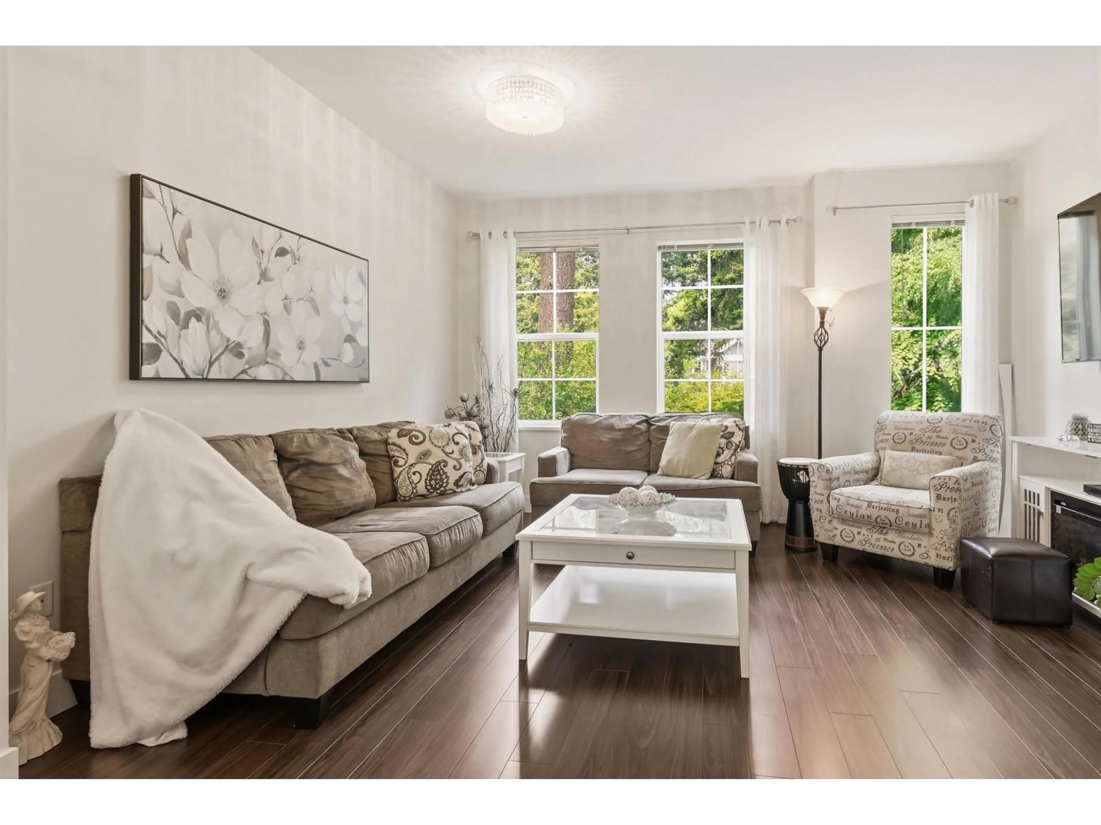 Living room with furniture, wood/laminate floor for 20 - 3399 151ST STREET, Surrey British Columbia V3Z0L3