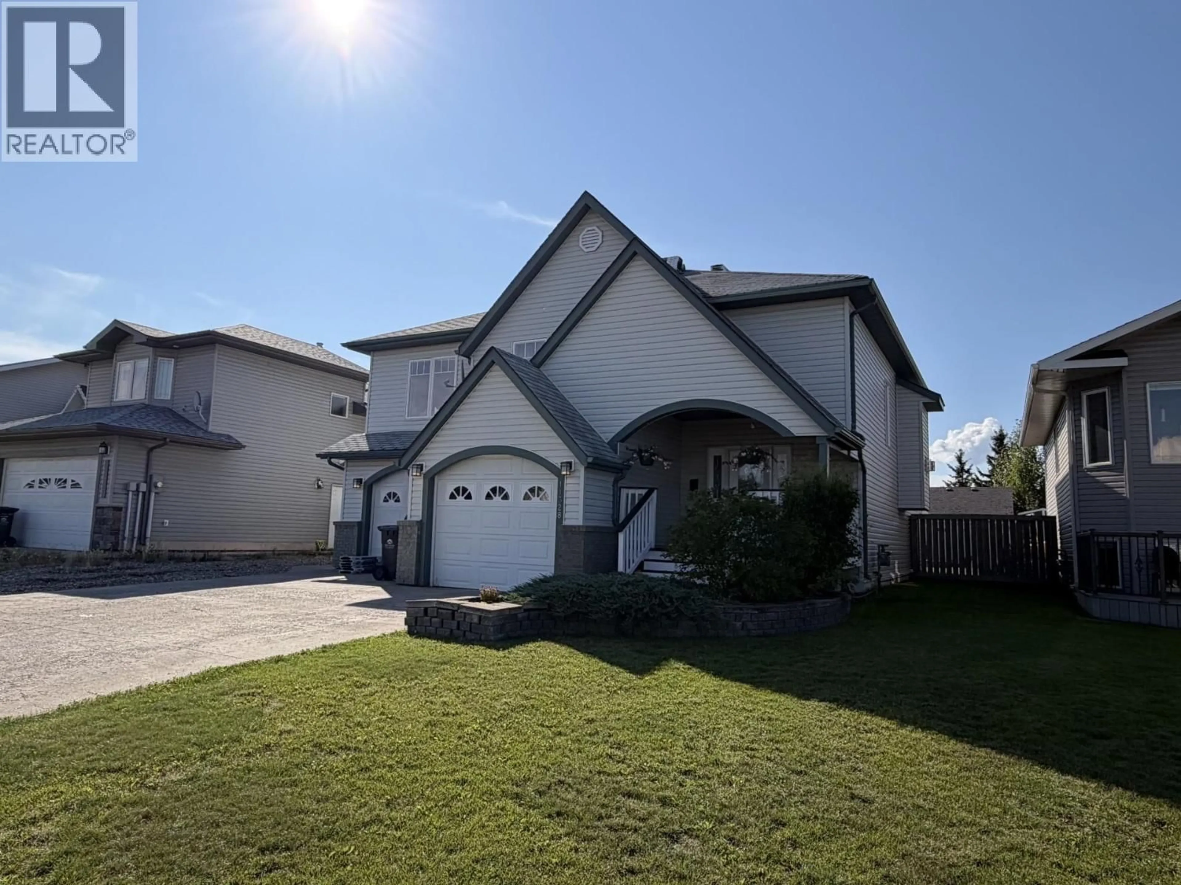 Home with vinyl exterior material, street for 11328 97 STREET, Fort St. John British Columbia V1J7H8