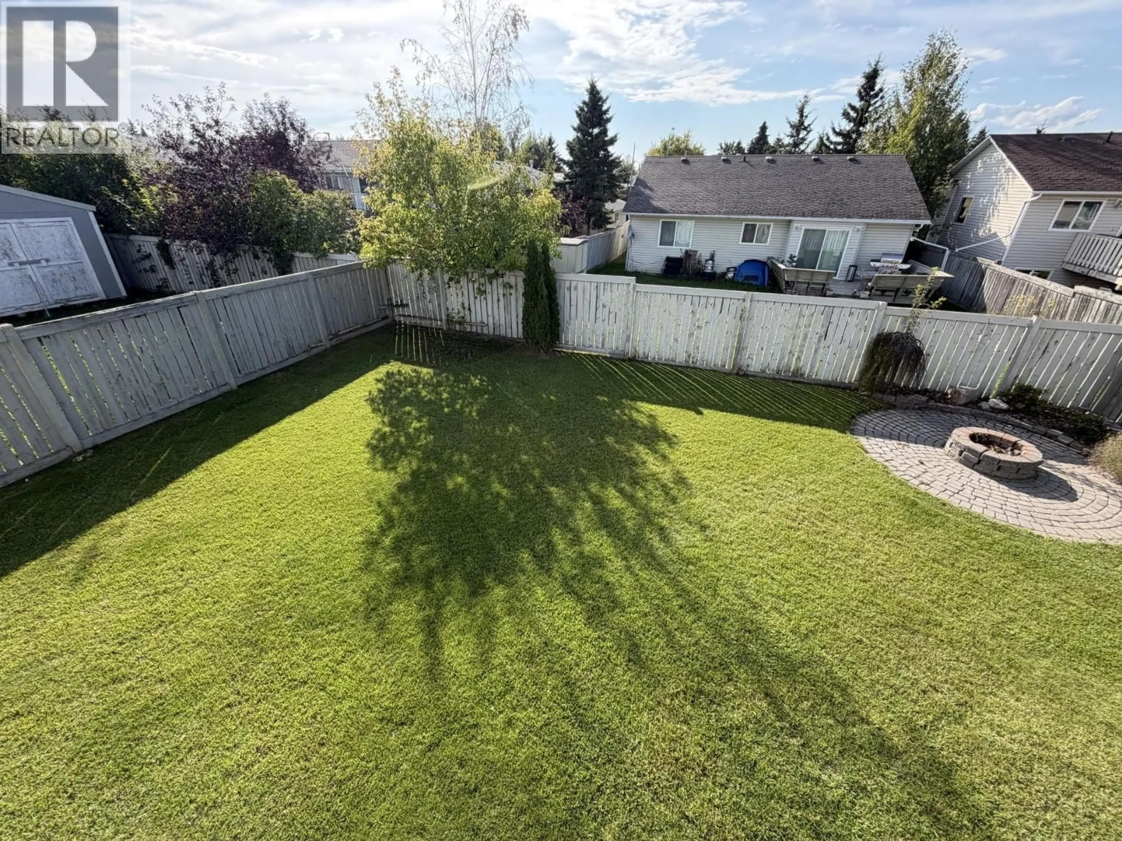A pic from outside/outdoor area/front of a property/back of a property/a pic from drone, mountain view for 11328 97 STREET, Fort St. John British Columbia V1J7H8