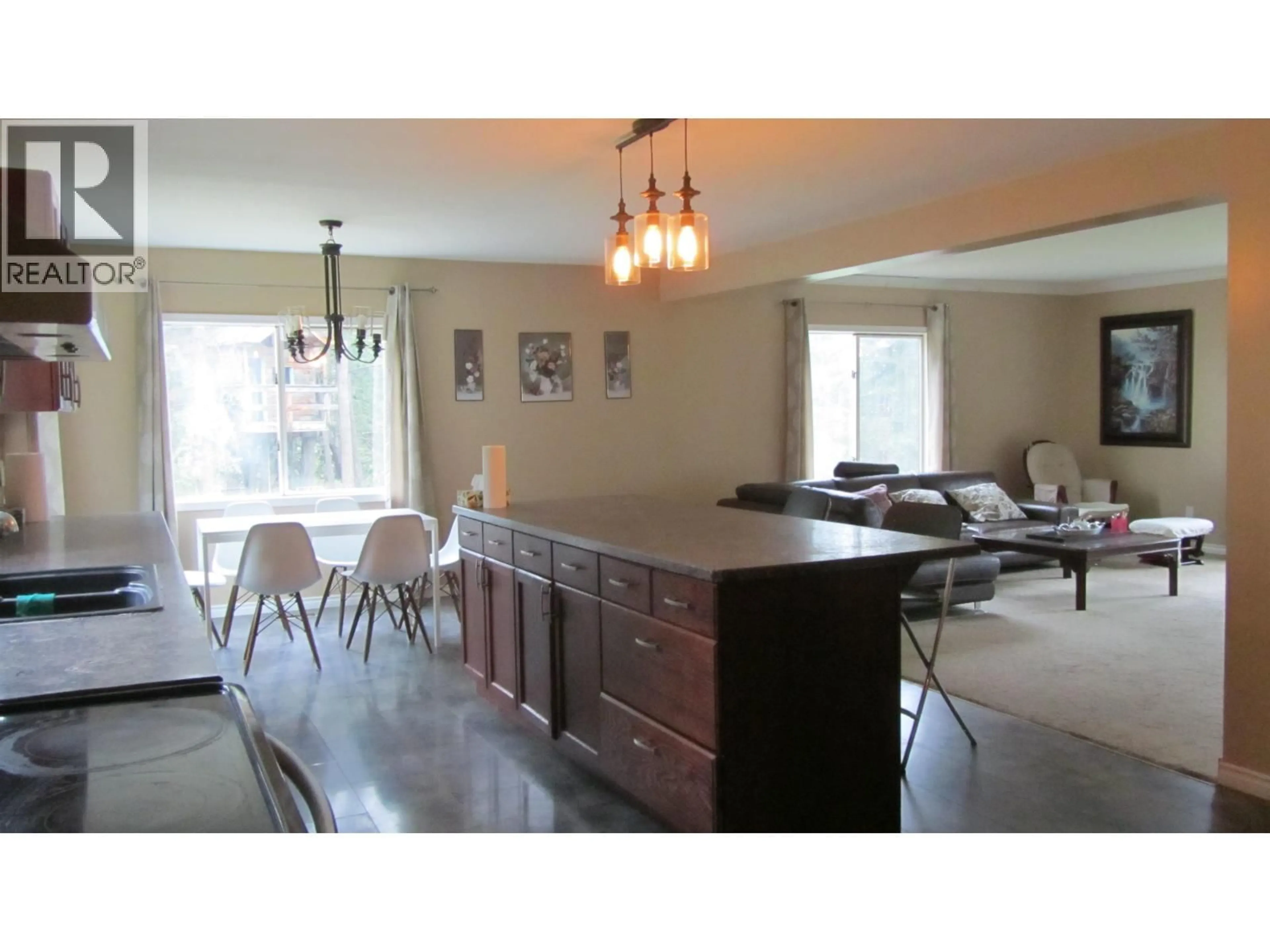 Open concept kitchen, wood/laminate floor for 6108 LONE BUTTE HORSE LAKE ROAD, 100 Mile House British Columbia V0K1X3
