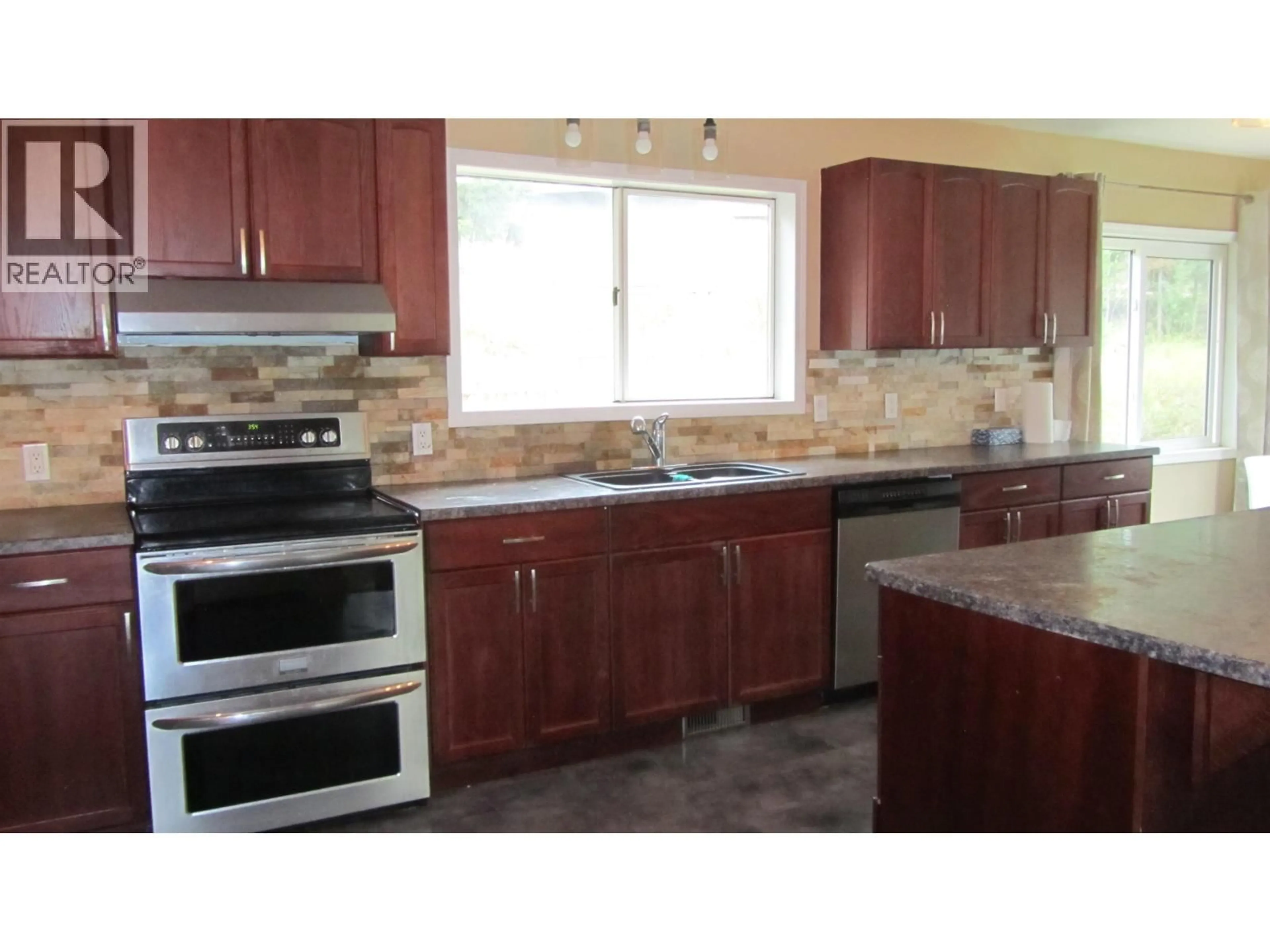 Open concept kitchen, ceramic/tile floor for 6108 LONE BUTTE HORSE LAKE ROAD, 100 Mile House British Columbia V0K1X3