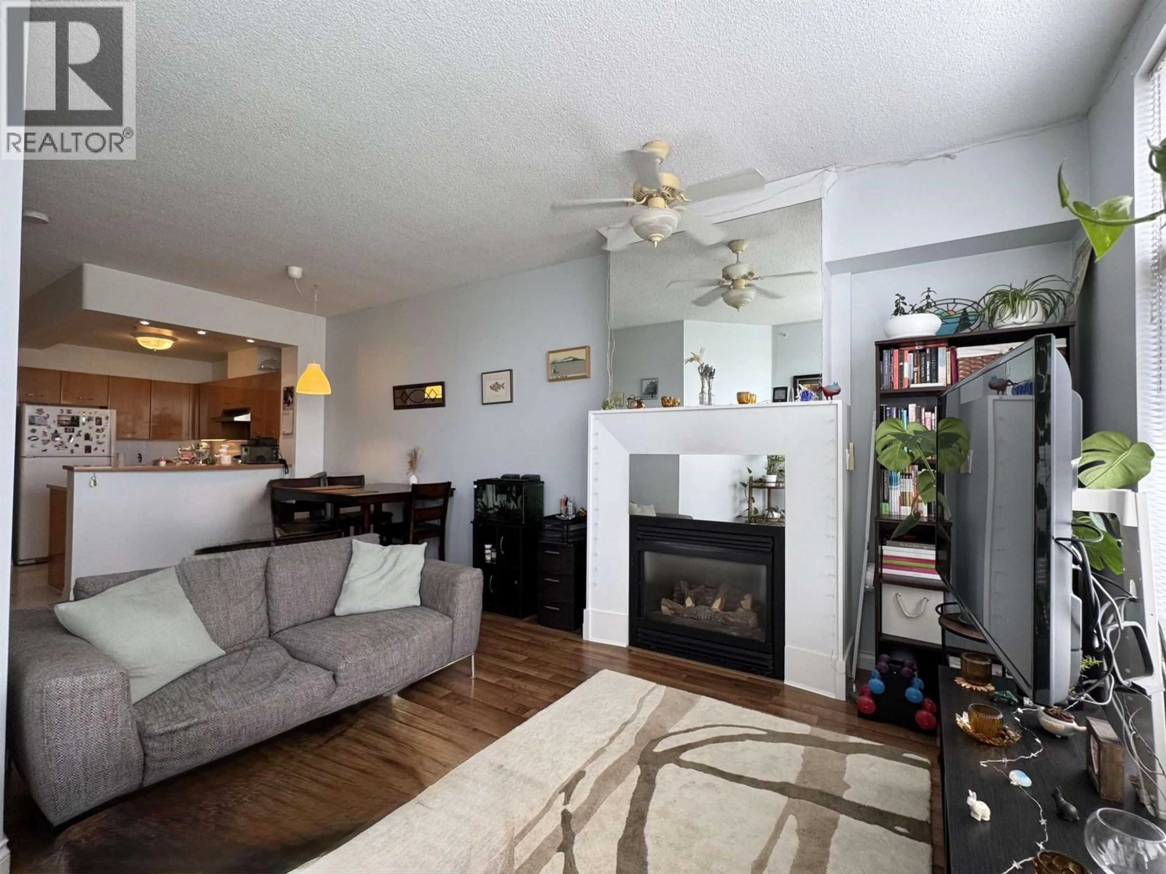 Living room with furniture, wood/laminate floor for 510 - 2268 REDBUD LANE, Vancouver British Columbia V6K4S6