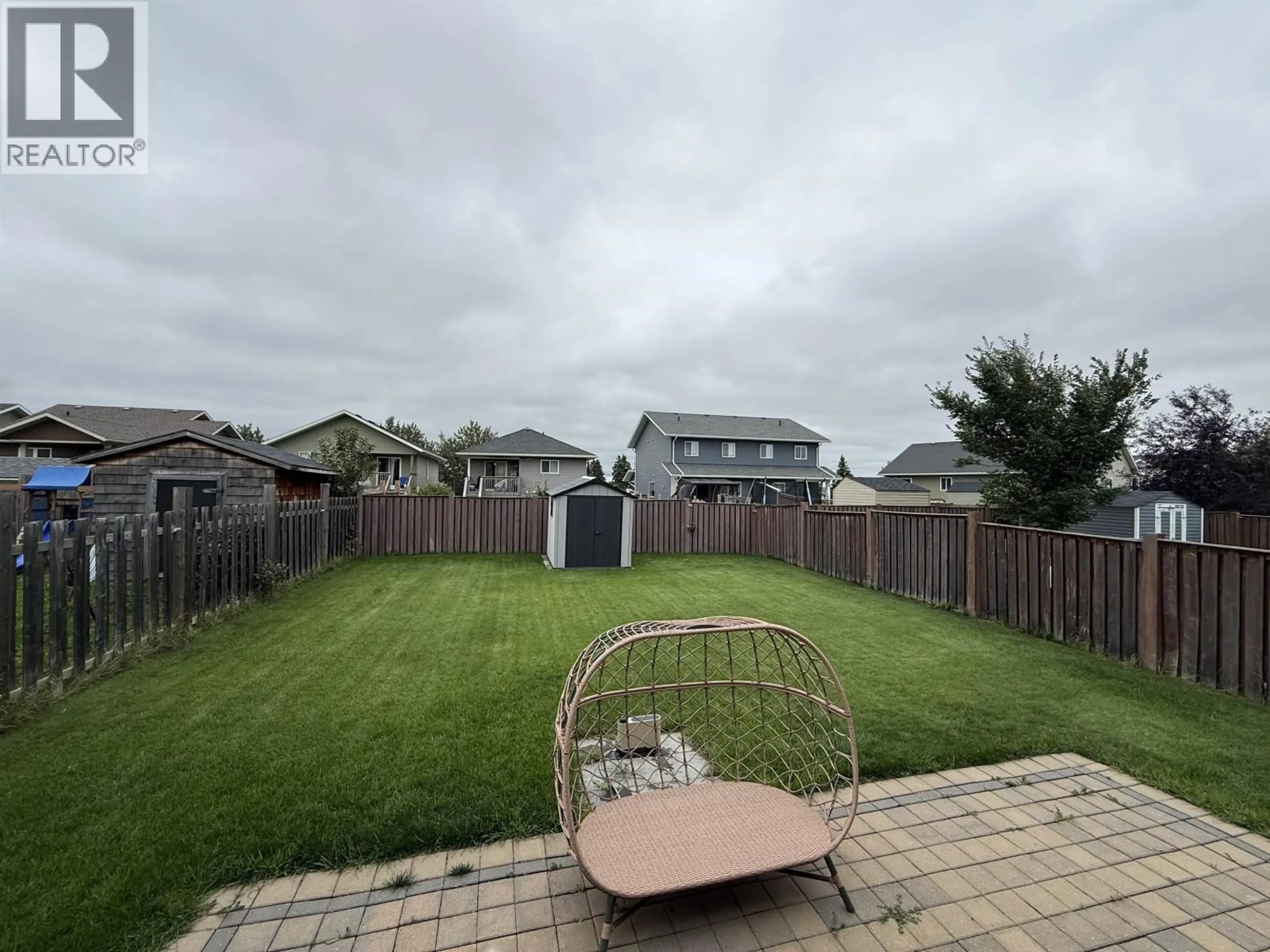 A pic from outside/outdoor area/front of a property/back of a property/a pic from drone, unknown for 8407 86 AVENUE, Fort St. John British Columbia V1J0G4